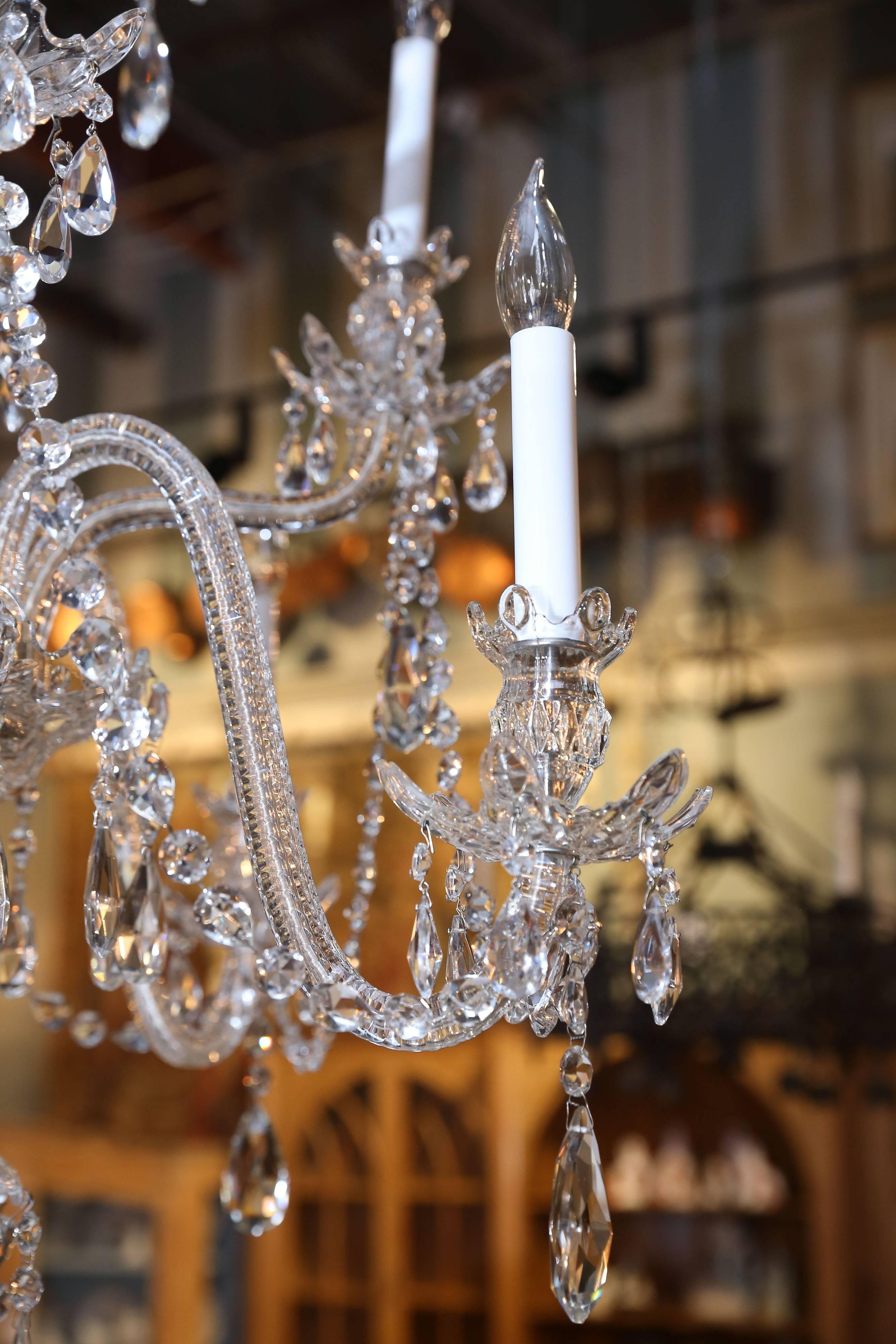 Lovely airy Baccarat crystal chandelier with swags, glass enclosed arms, lots of etching, from the top to the finial on the bottom.


 