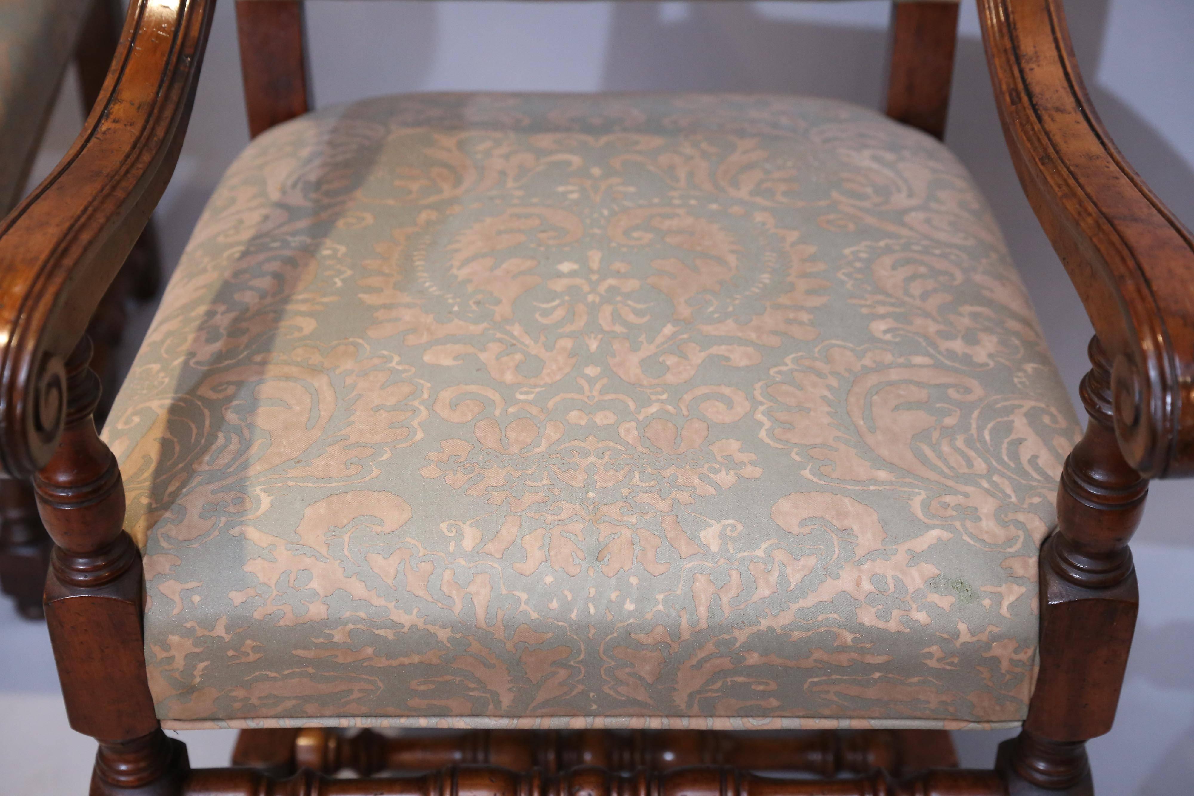 Carved Set of Eight French Louis XIV-Style Walnut Dining Chairs Upholstered in Fortuny For Sale