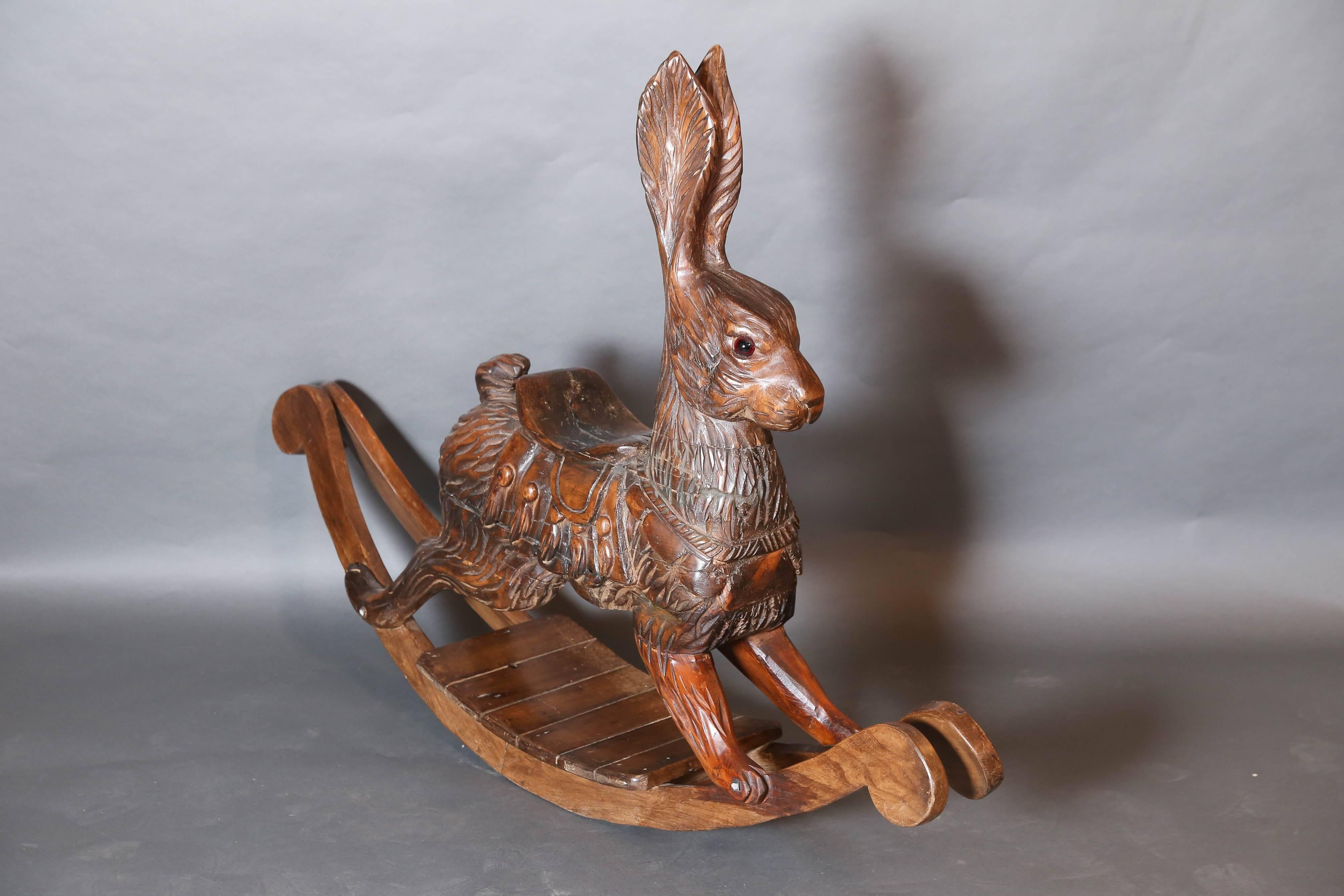 Fruitwood carousel bunny rabbit is carved with great detail showing the texture of fur.

Bunny has glass eyes and long rocking blades,added later and his ears stand-up.

Darling gift for Grandparents to give as a future heirloom.


 