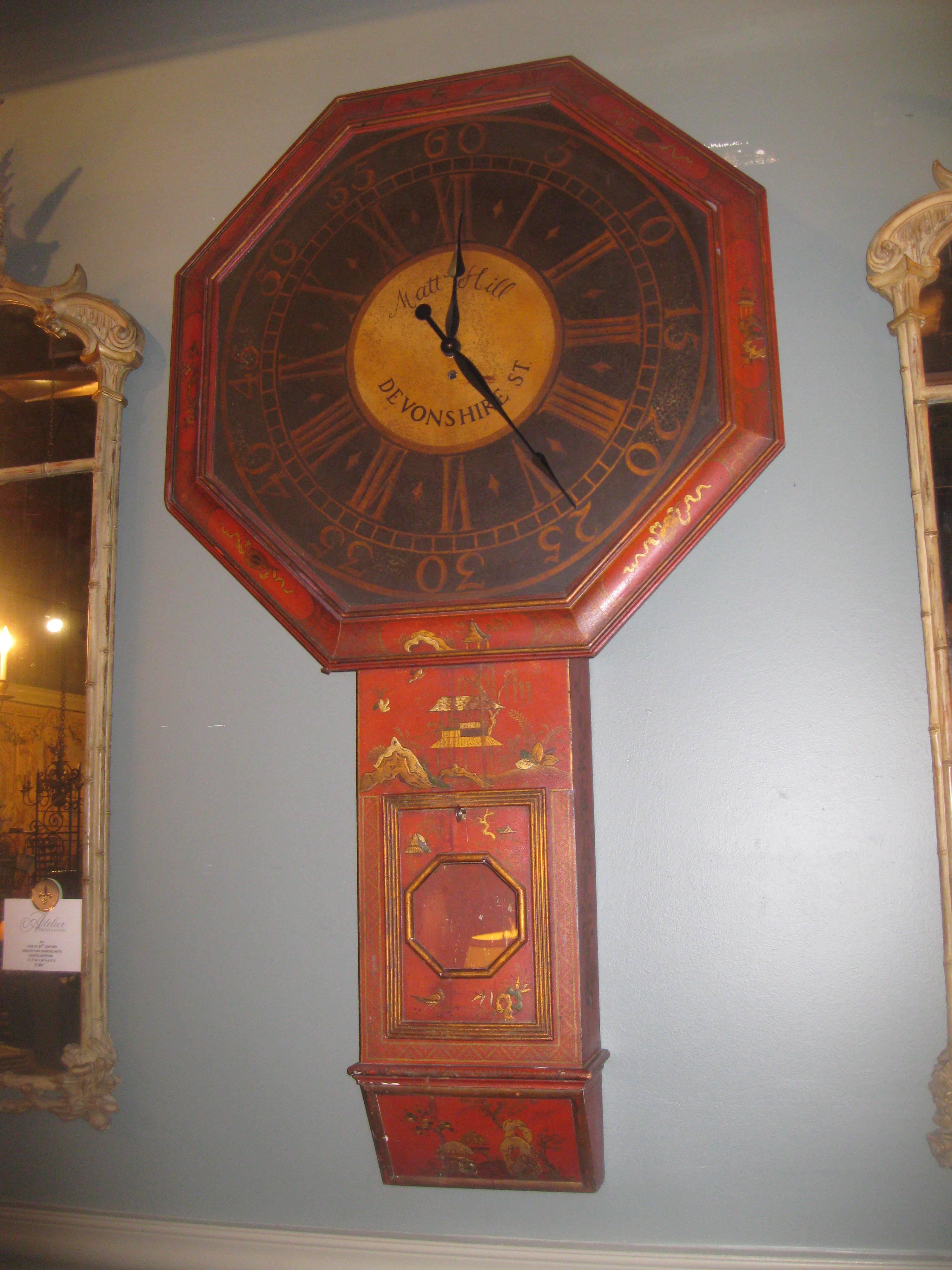 Whimsical, yet serious-looking large wall clock is painted with chinoiserie decoration, painted by McMillan & Co.

Black clock face keeps time with a battery-operated mechanism.

Does have original pendulum, that works.

 