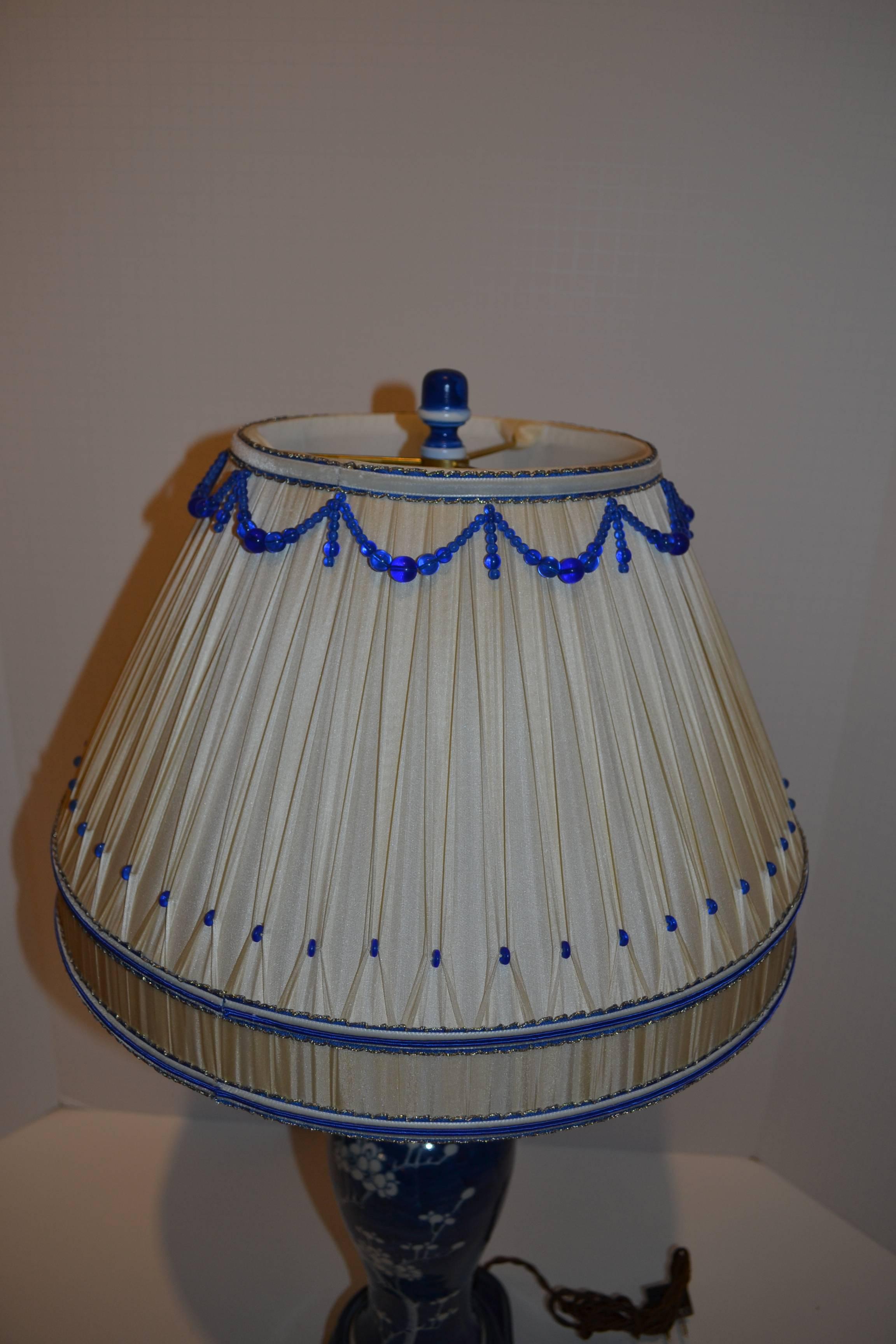 Chinese Pair of Blue and White Lamps with Dressmaker Shades