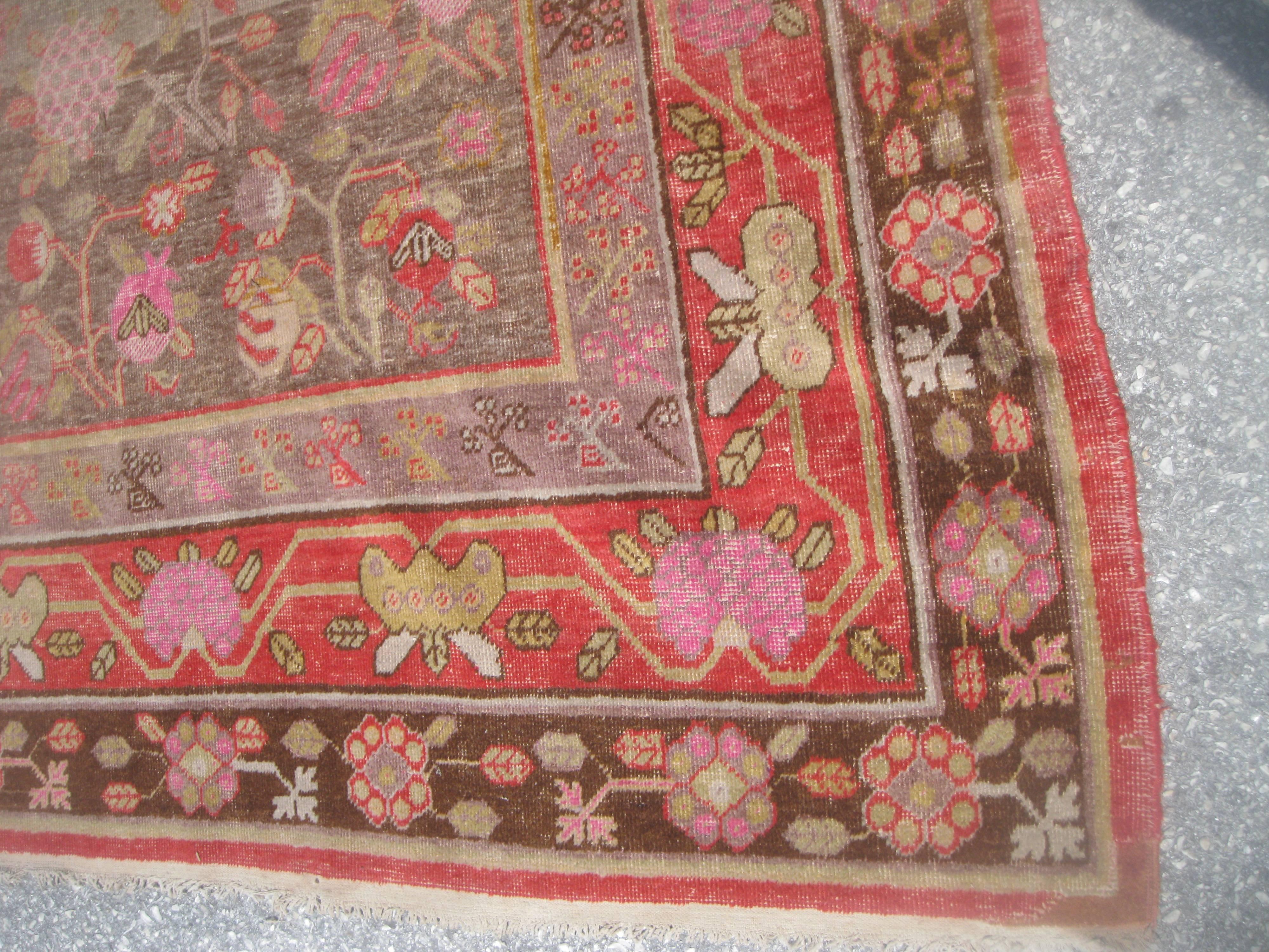 Turkestan Antique Khotan Rug with Eight Band Border in Browns and Oranges For Sale