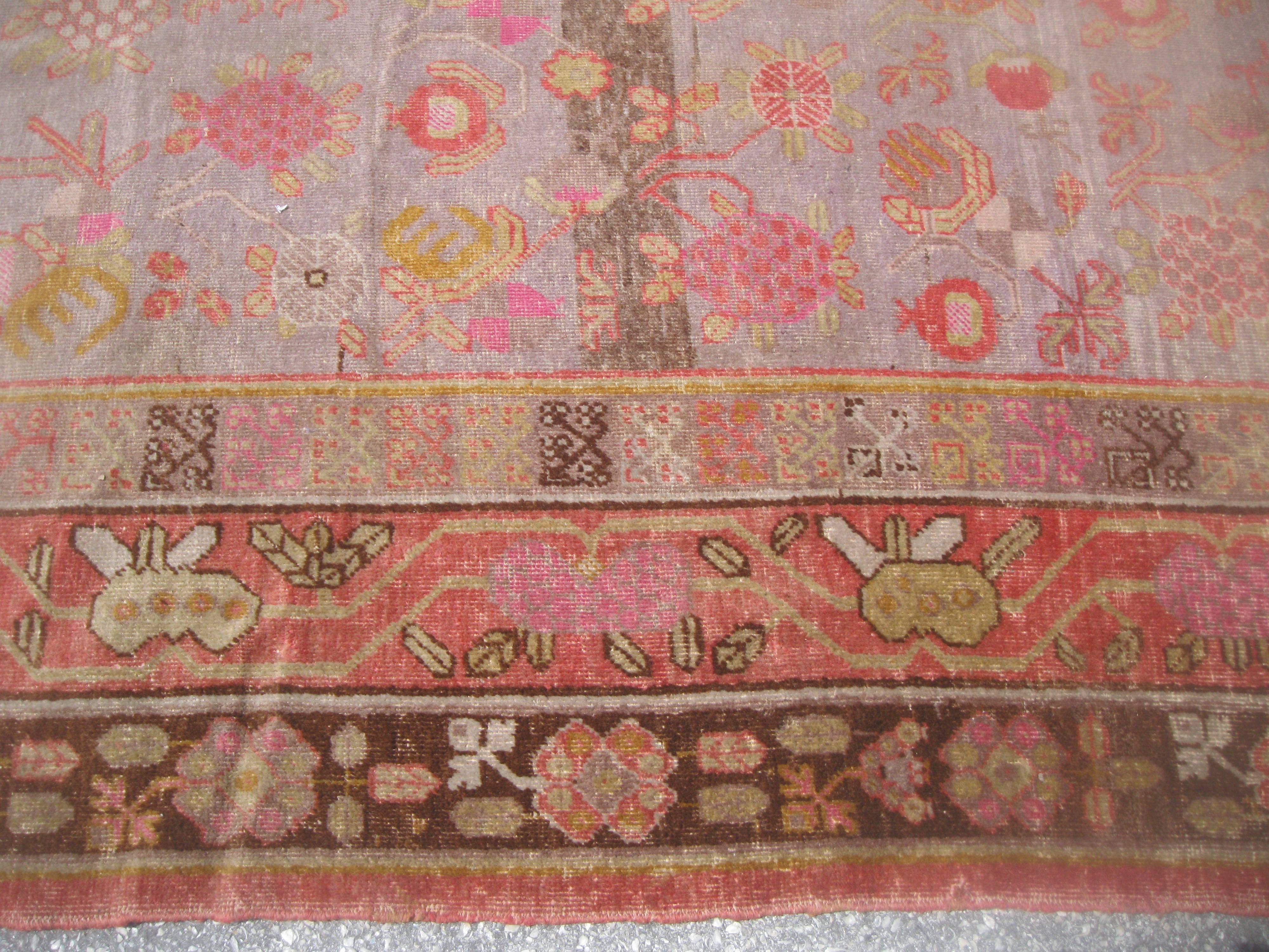 Antique Khotan Rug with Eight Band Border in Browns and Oranges In Good Condition For Sale In Houston, TX