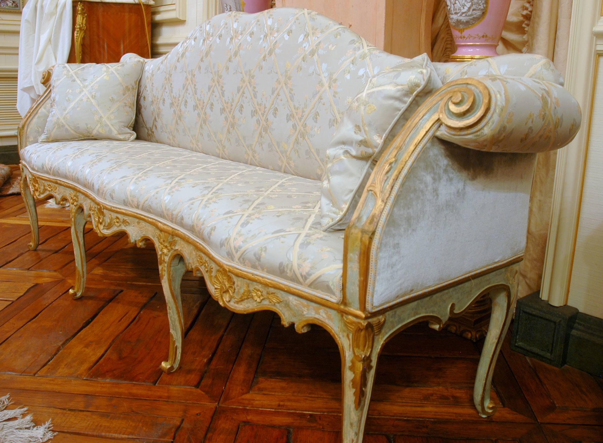 Painted and gilt Venetian Louis XV settee is highly decorative
and quite suitable for an entry as it is only 21