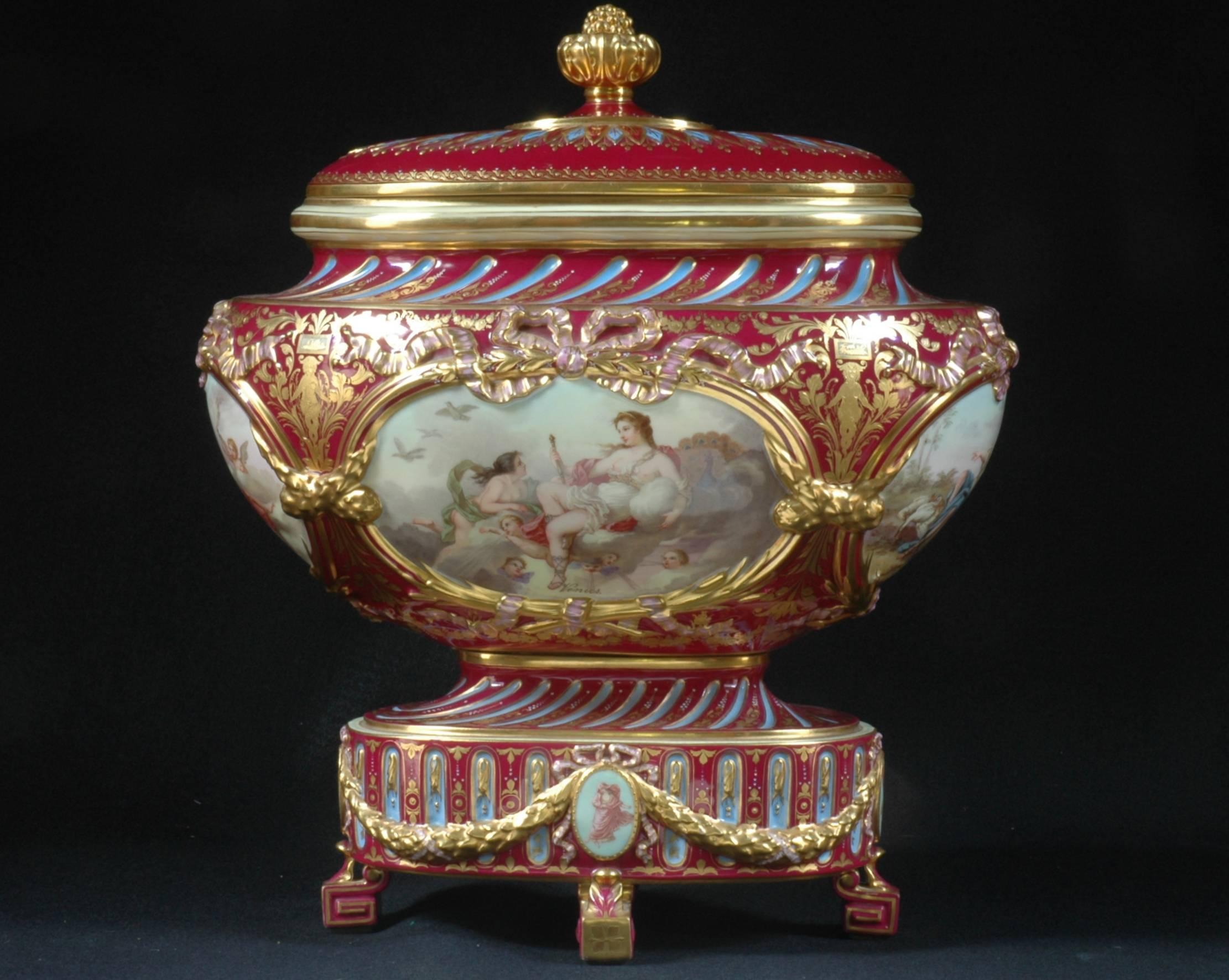 Very elaborate 19th century covered royal Vienna urn features four oval paintings of women. There are gilt bows above each oval and gilt foliage surrounding each section.
Diagonal painted fluting design compliments panels above and below with a