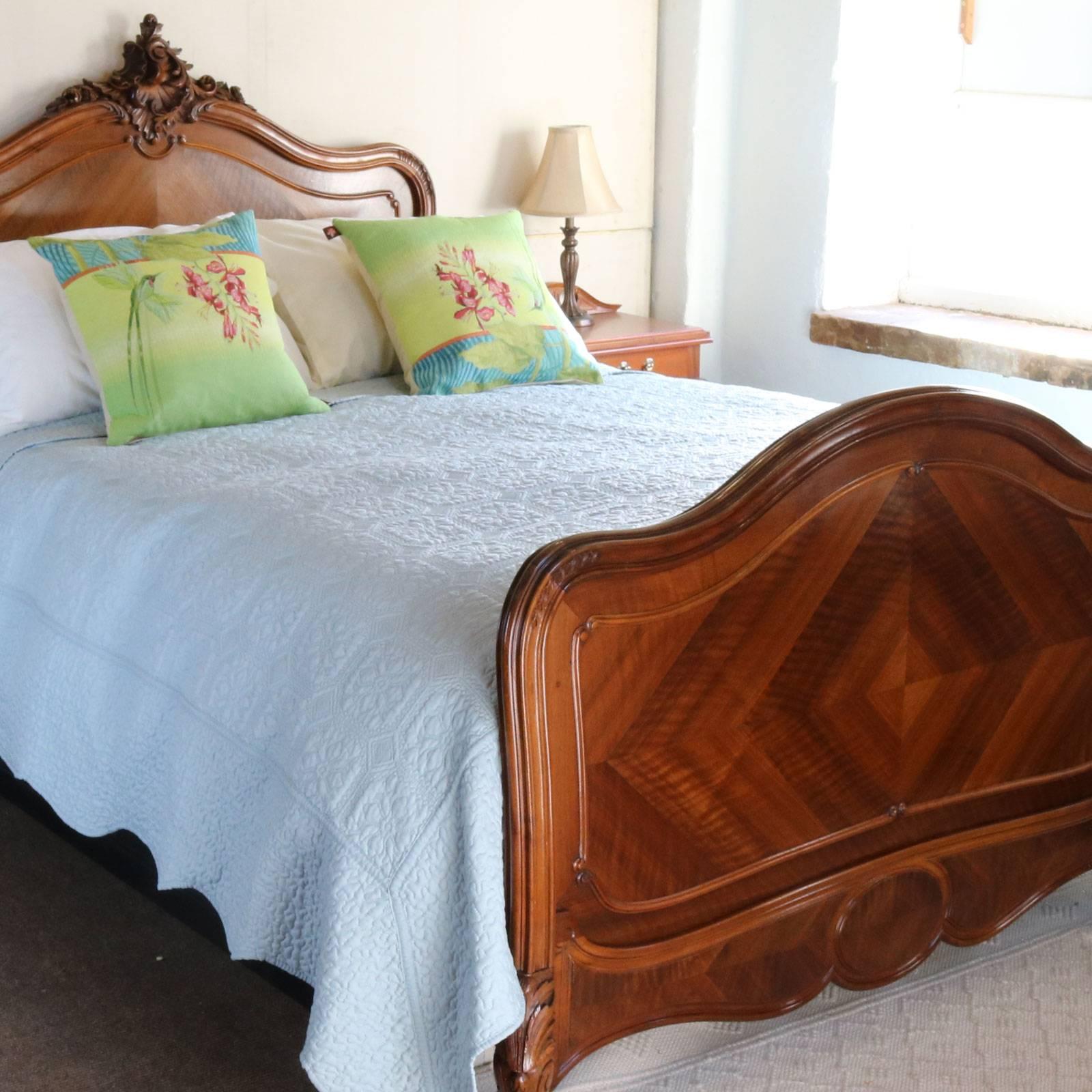 A walnut Louis XV bed with beautifully shaped frame and lovely quarter panels.

This bed accepts a 60in wide (British King or American Queen) bed base and mattress set.

The price is for the bedstead alone, the base, mattress and bedding are