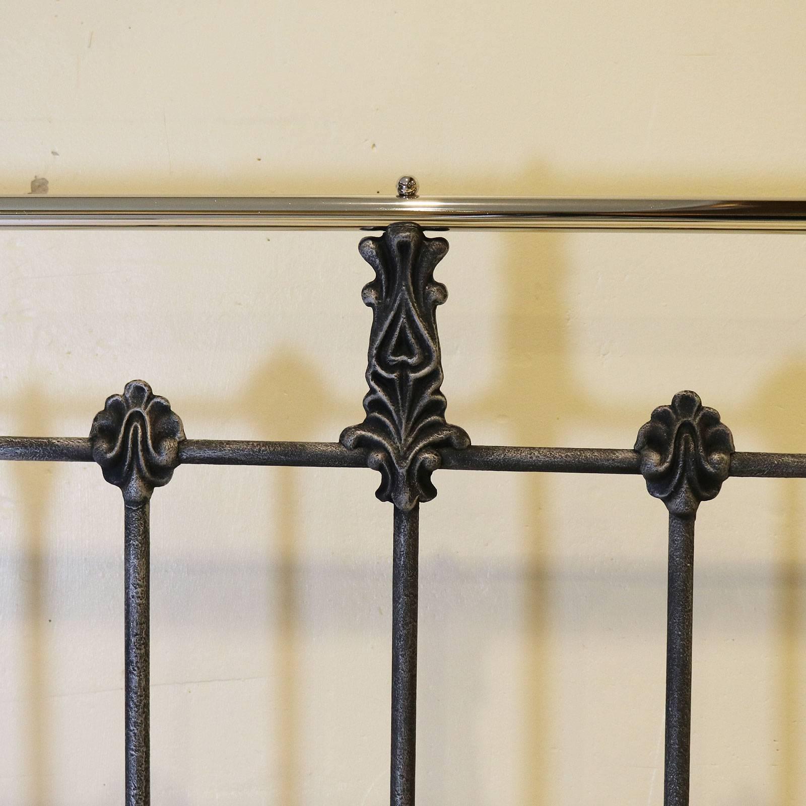 A metal bed with decorative castings and nickel-plated brass work, adapted from an original Victorian bed, finished in black with silver paint effect.

This bed accepts a British king-size or American queen-size (60 inches, 5ft or 150cm wide) base