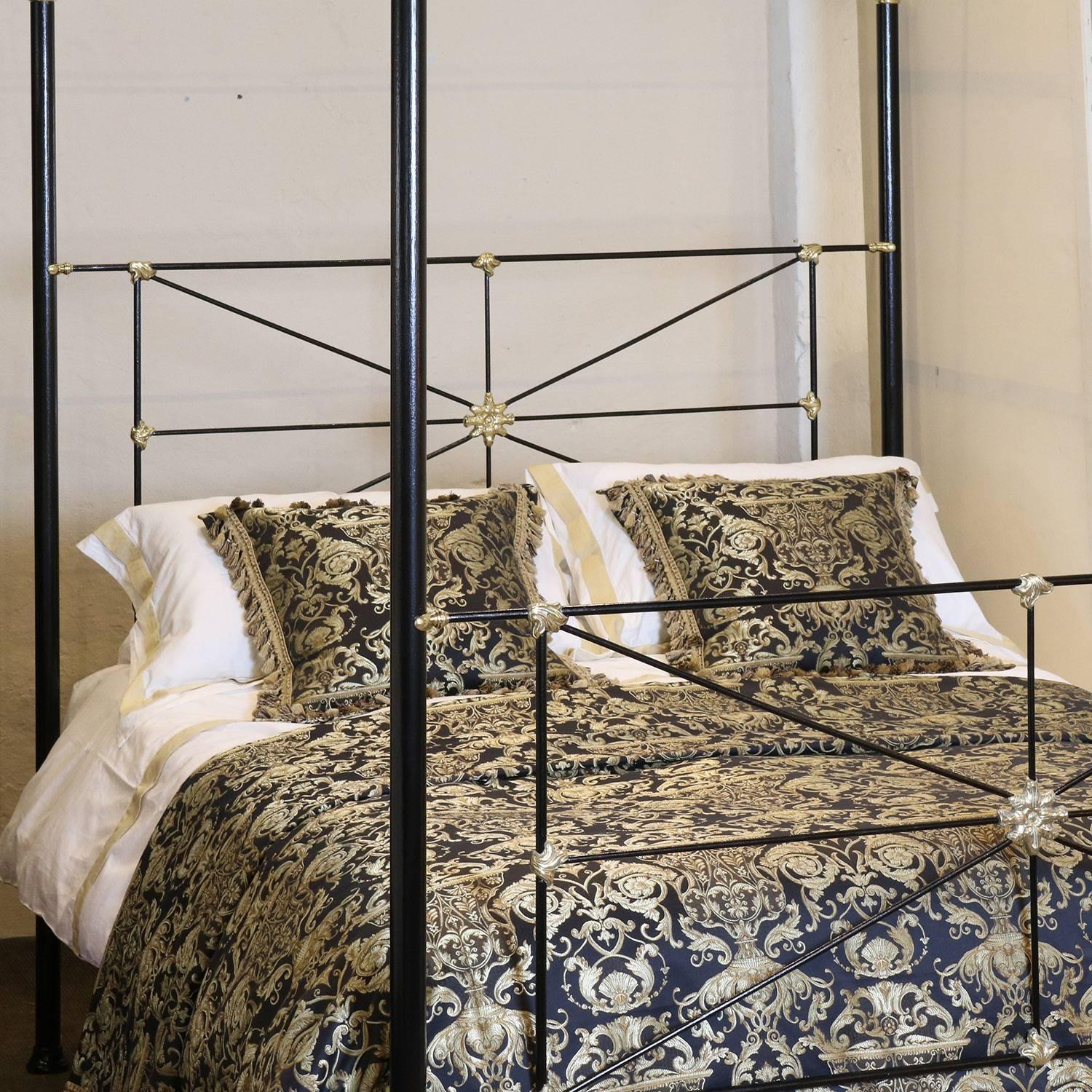 A bespoke made-to-measure four poster bedstead in the campaign style with steel framework, brass castings, brass knobs, brass collars, brass kneecaps and brass feet. The shaped canopy is a particular feature of this bed. We have made this bed