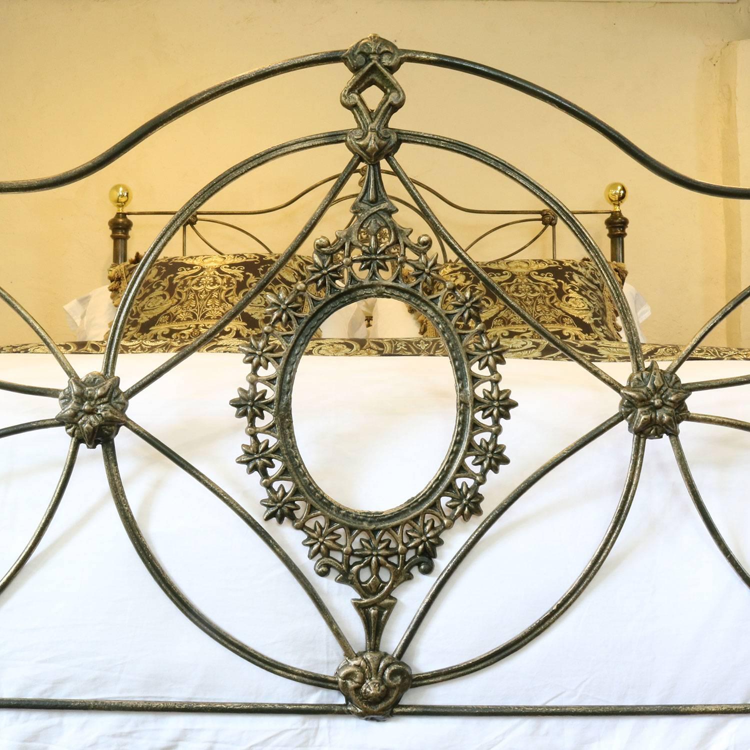 A superb cast iron bedstead finished in juniper green, with gold highlighting.

This bed accepts a British king-size or American queen-size (60 inches, 5ft or 150cm wide) base and mattress.

The price is for the bed frame alone. The base,