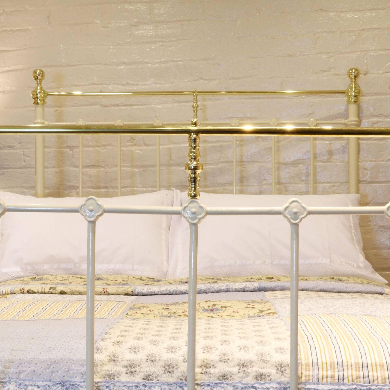 Double brass and iron bedstead in cream with a brass top rail and ornate castings.

This bed accepts a double size (54 inches, 4 ft 6 in or 135 cm wide) base and mattress.

The price is for the bed frame alone. The base, mattress, bedding and