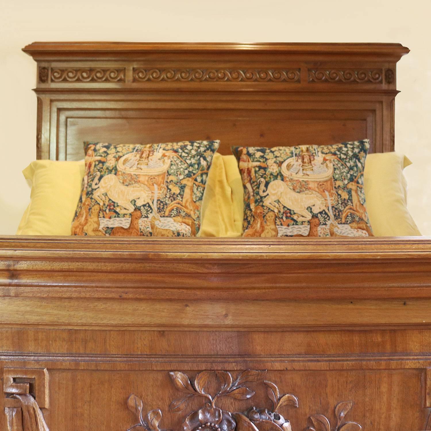 A walnut Edwardian bed with fine carving in the footboard depicting floral motifs.

This bed accepts a British king-size or American queen-size (60 inches, 5ft wide or 150cm) base and mattress set.

The price is for the bed frame alone. The