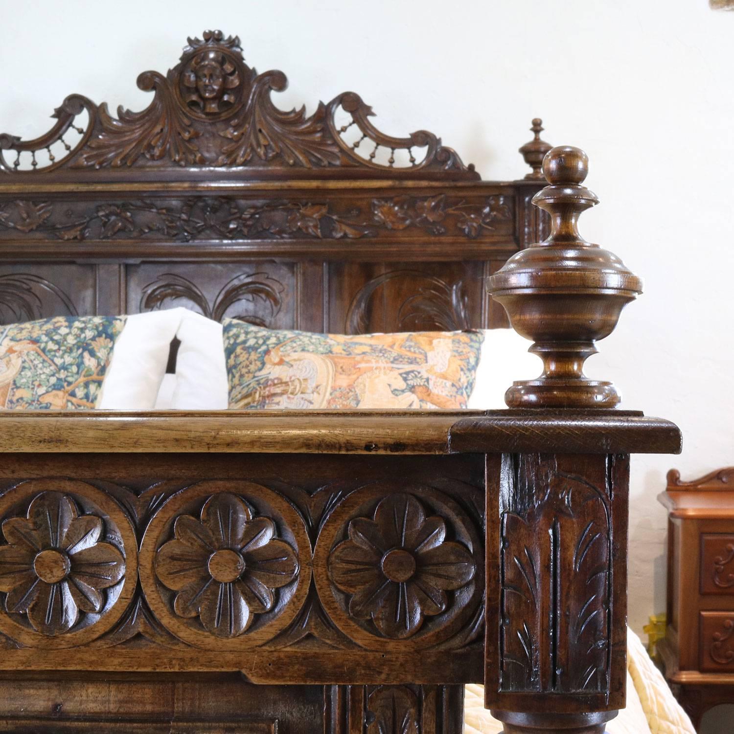 An oak Breton bed with fine carvings depicting rural scenes.

This bed accepts a British king-size or American queen-size (5ft, 60 in or 150 cm wide) base and mattress set.

The price is for the bed frame alone. The base, mattress, bedding and