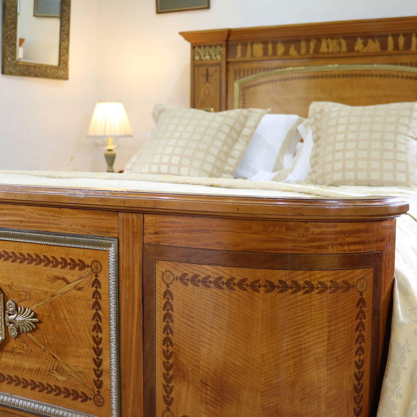 A fabulous Empire style bed with superb Greco-Roman inspired inlay work. The framework is mahogany with fruitwood inlay and ormolu decoration.

The price is for the bedstead alone, the base, mattress and bedding are extra and can be provided by
