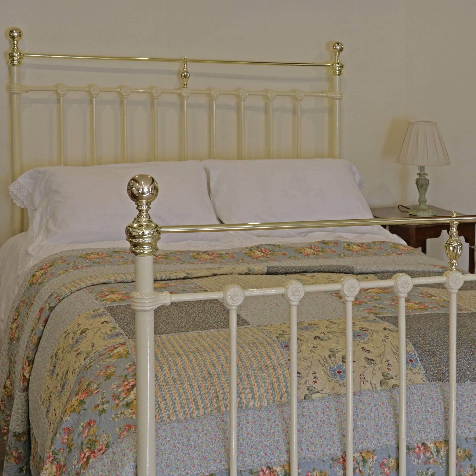 A Victorian cast iron and brass bedstead in cream with straight top brass rails in the 5ft width, circa 1895.

This bed accepts a British king-size or American queen-size base and mattress set.
The price is for the bedstead alone. The base,