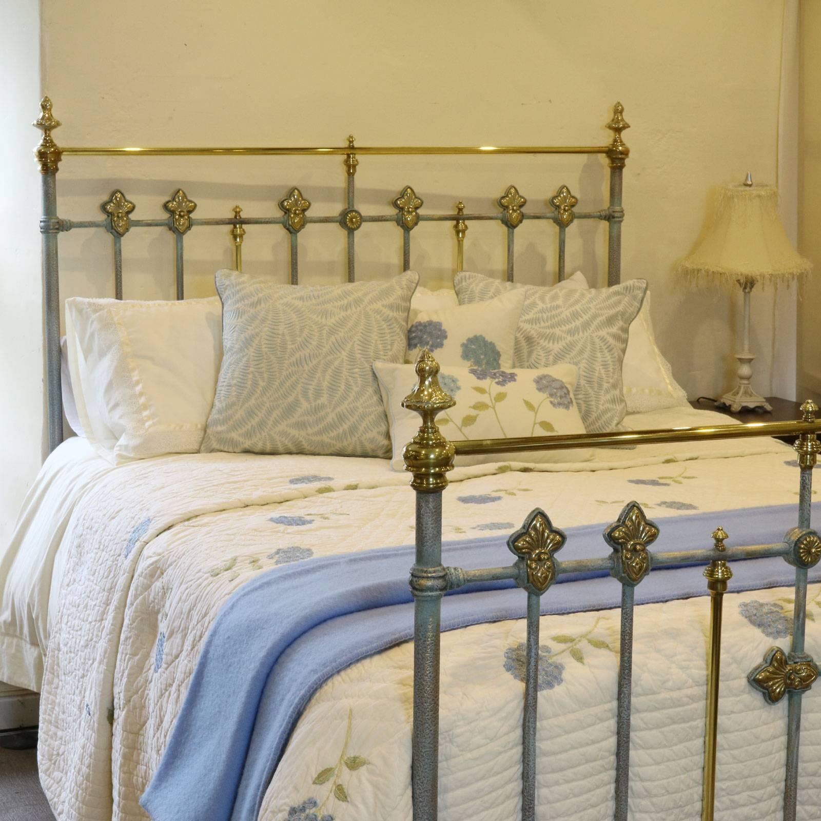 This superb bed has ornate brass decoration including brass rosettes and central barley twist brass ring, 5ft wide.

The ironwork has been finished in our hand paint finish of blue verdigris, a textured and layered effect with tones of blues,