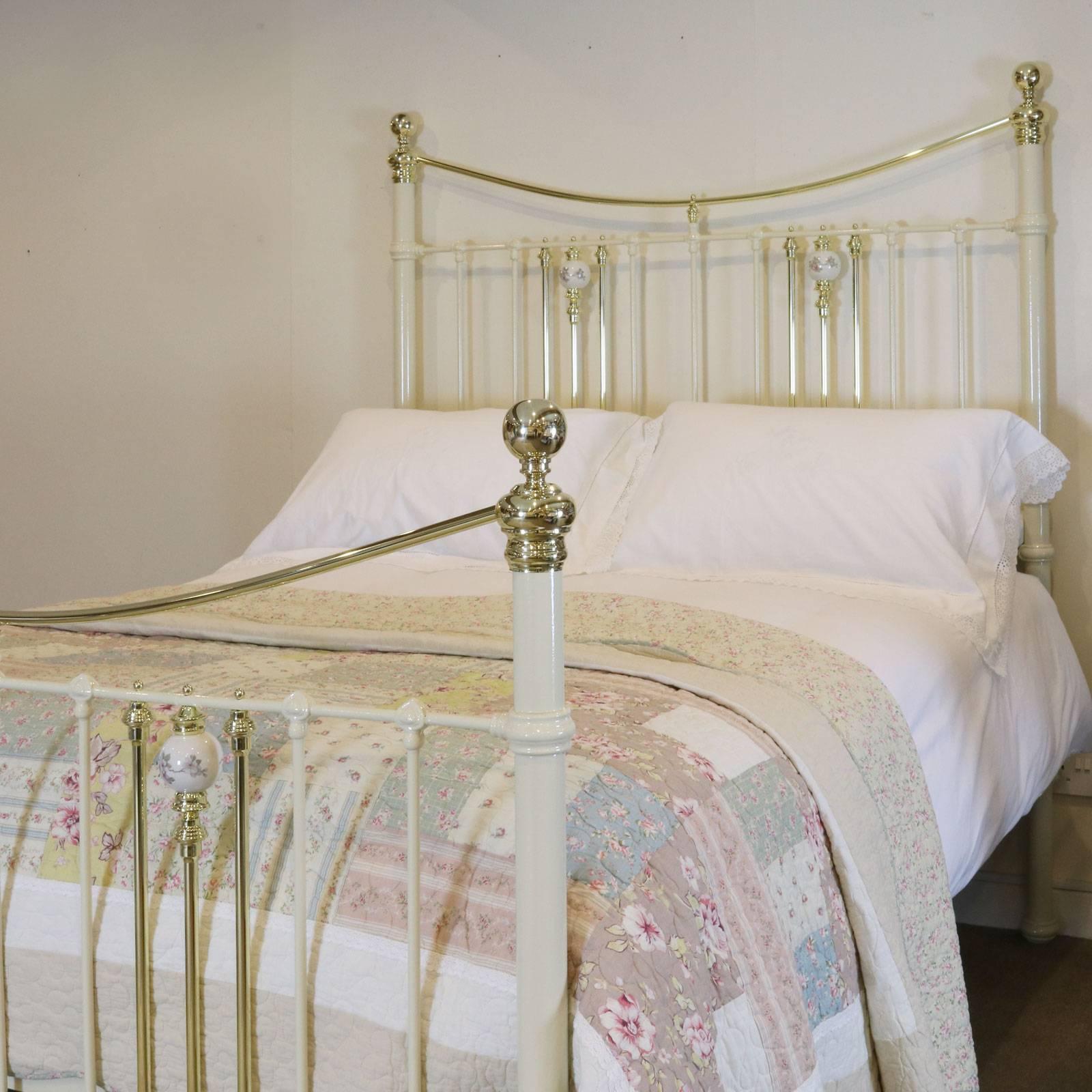 This fine bed adapted from an original Victorian bed with china ball decoration, triple brass down bars and curved brass top rail. It takes a 5 feet wide (60 in wide) British king-size or American queen-size base and mattress.

The price is for the