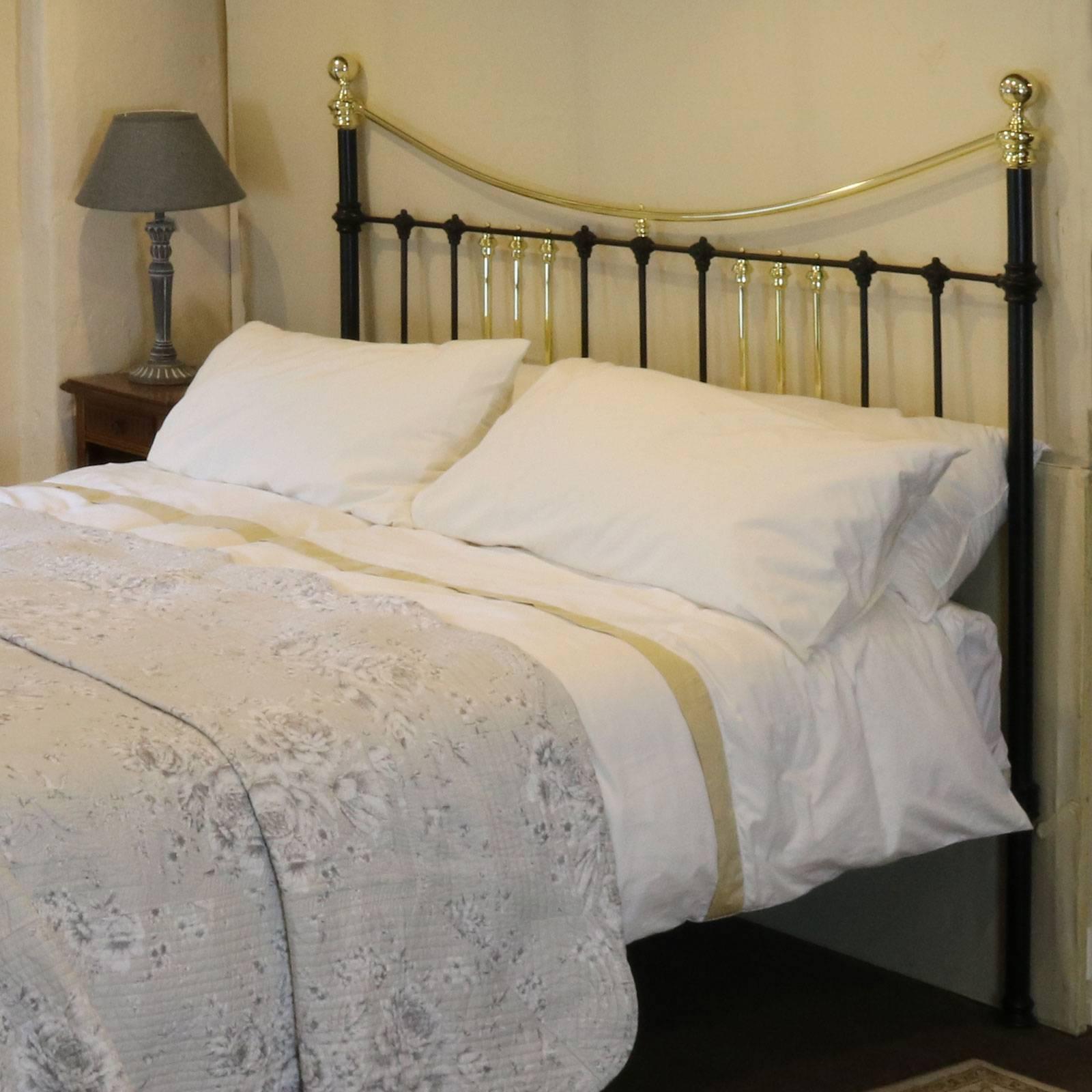 A Victorian bed adapted from an original frame with curved brass top rails and groups of three brass down bars, circa 1890.

This bed accepts a British Super King or Californian King (72 in or 180 cm wide) base and mattress set.

The price is