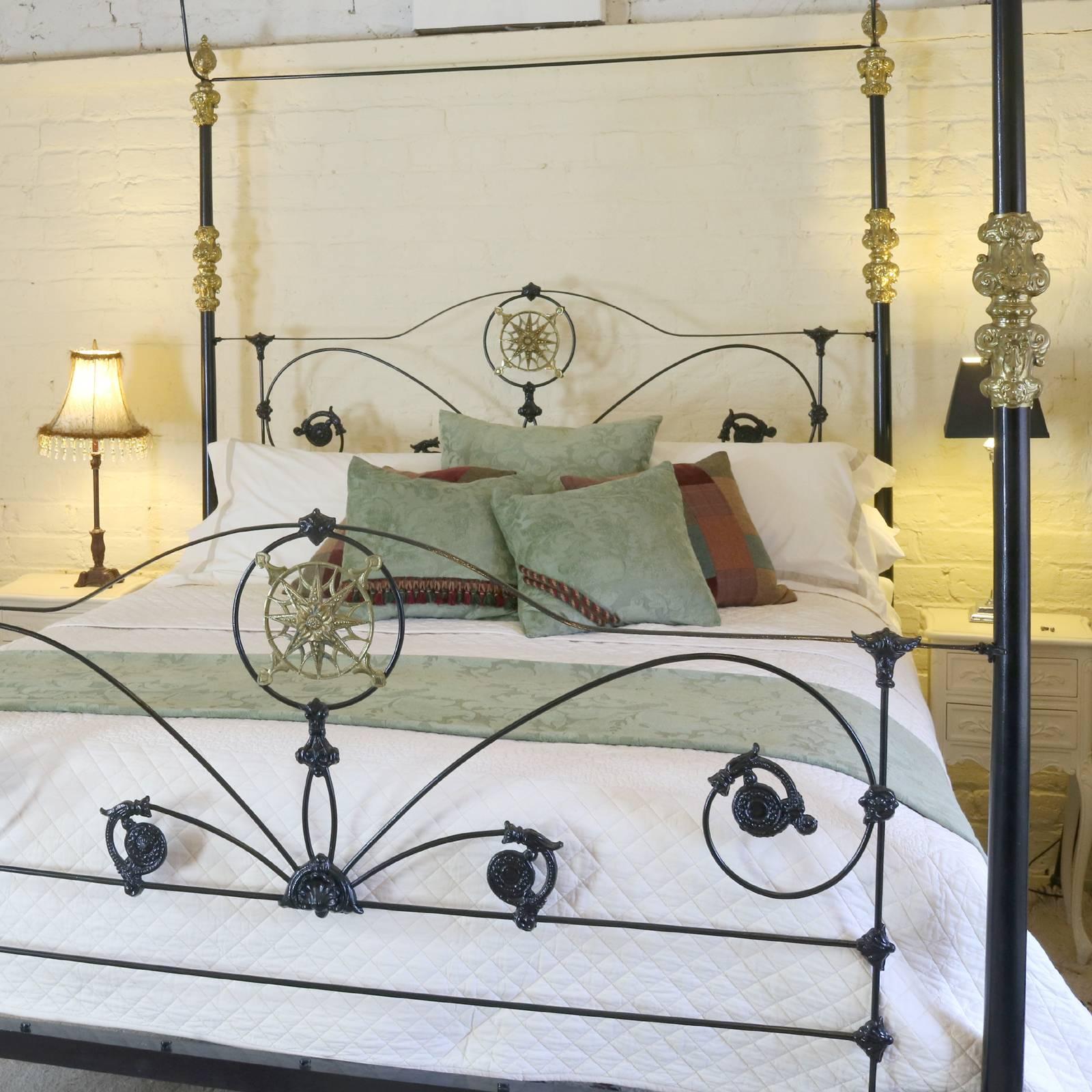 A superb cast iron four poster bed adapted from an original mid Victorian frame dating back to 1880 with cast central brass plaque, collars and finials. 

This four poster comes with the arched canopy as shown in the photographs or a straight
