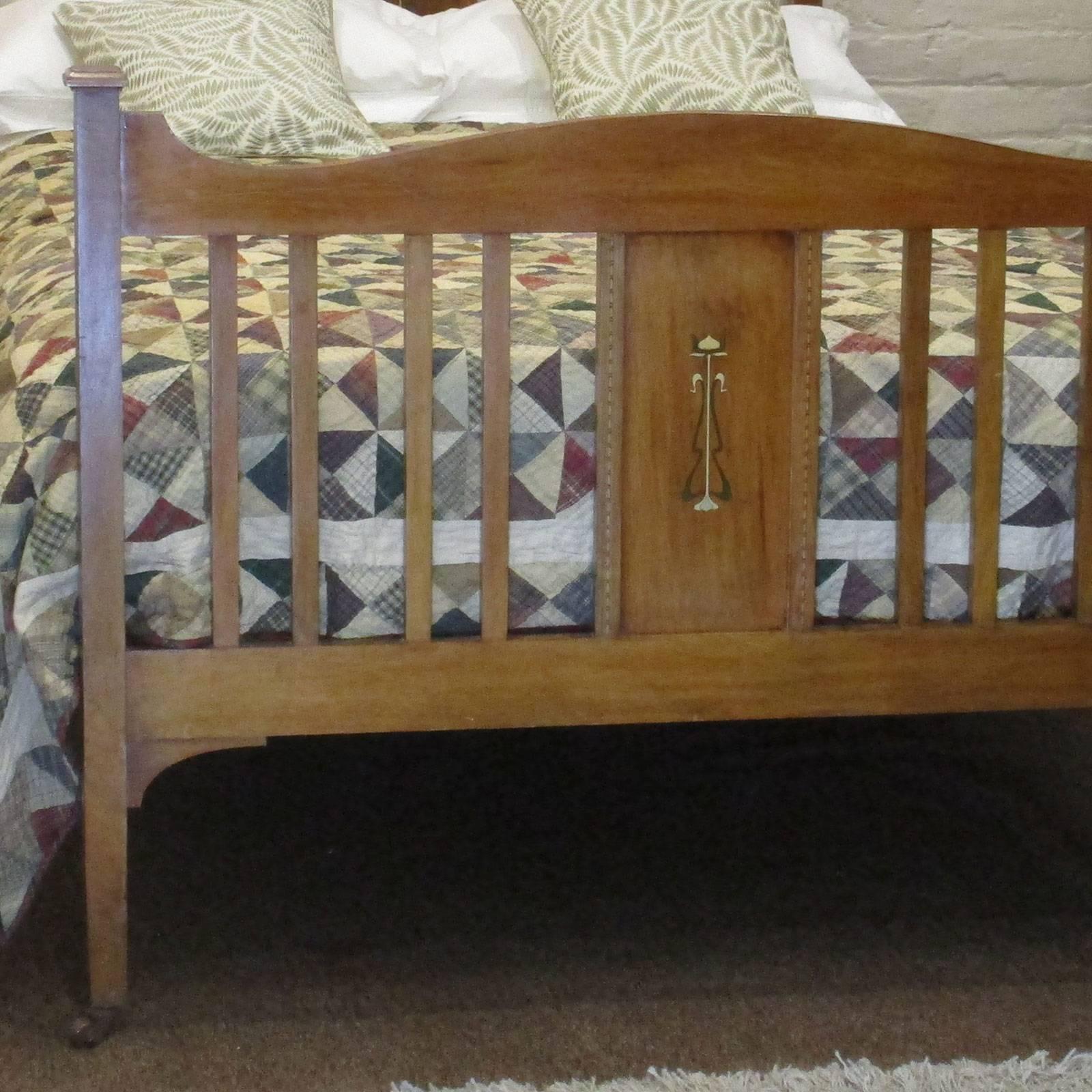 A simple but elegant Edwardian bed made from mahogany with Art Nouveau inlay. Each side of the shaped bed ends are pagoda cups and original ceramic castors to finish off the look.

The bed accepts a 4ft 6in wide (54 in wide) base and