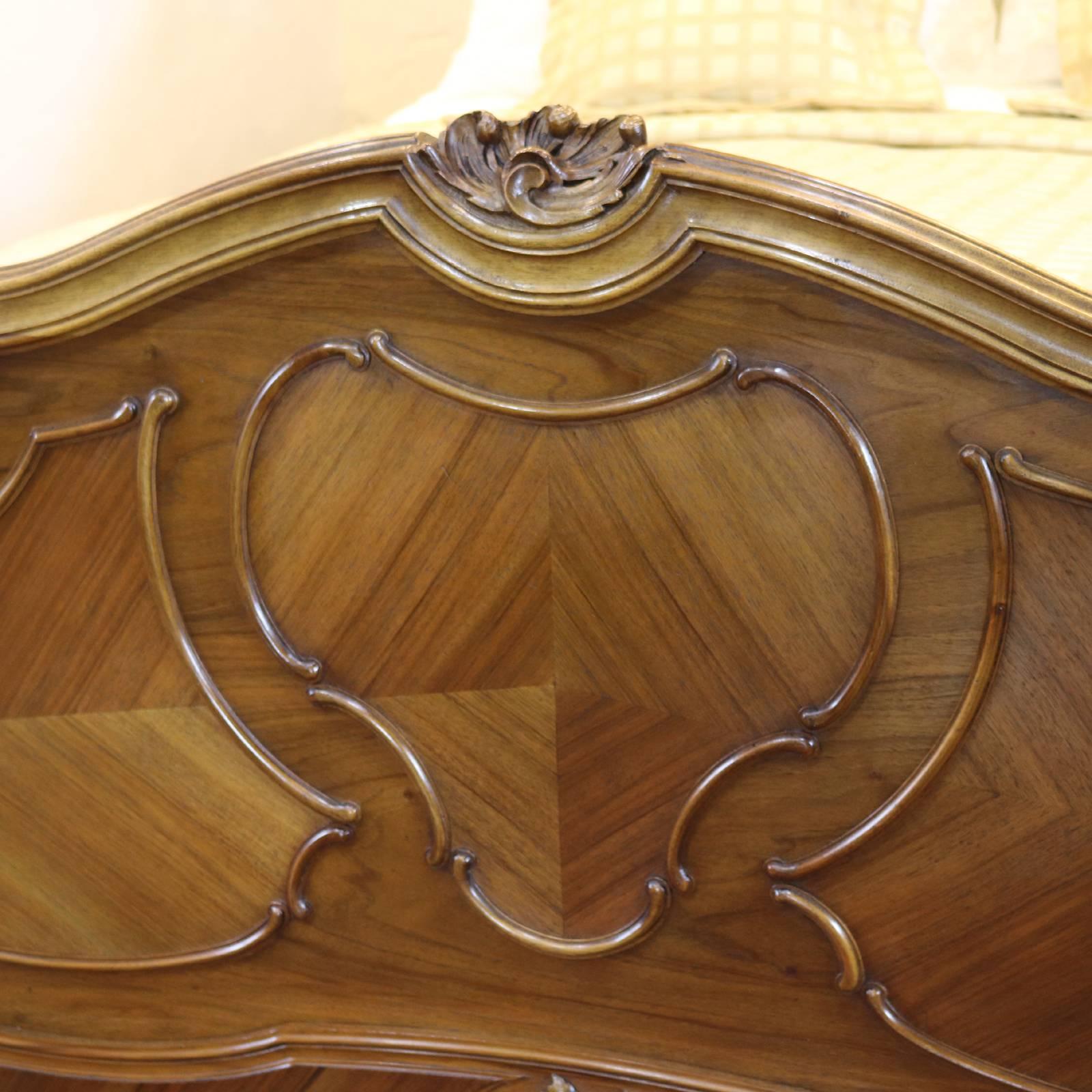A Louis XV style bed in walnut with beaded panels and carved head pediment.

This bed accepts a 60 inch wide (UK king-size or American Queen Size) base and mattress.

The price is for the bed frame alone. The base, mattress, bedding and linen are