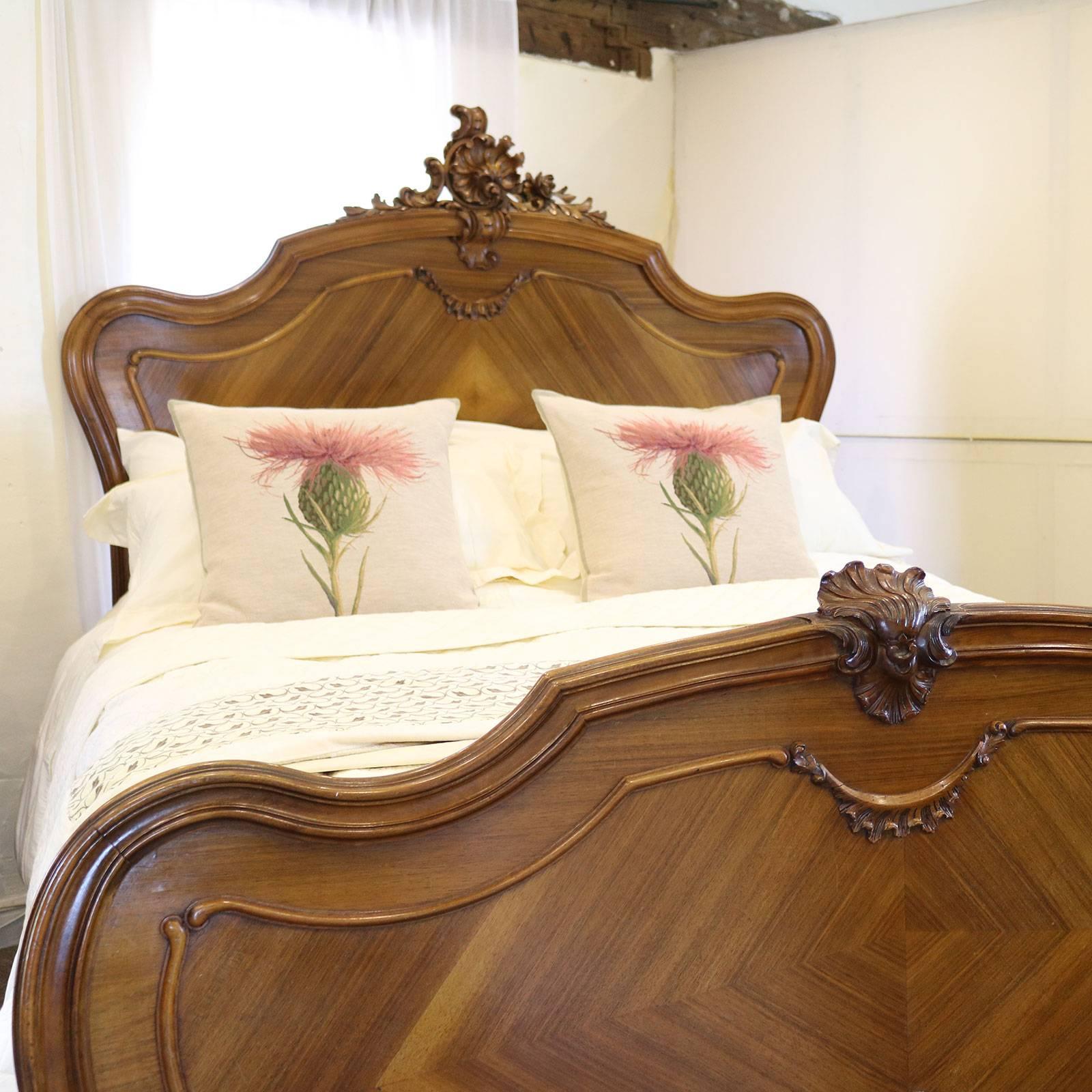 A French Louis XV style bed with ornate carving on the head panel and shaped head and foot boards.

This bed accepts a British king-size or American queen-size (60 in wide) base and mattress set.

The price is for the bed frame alone. The base,