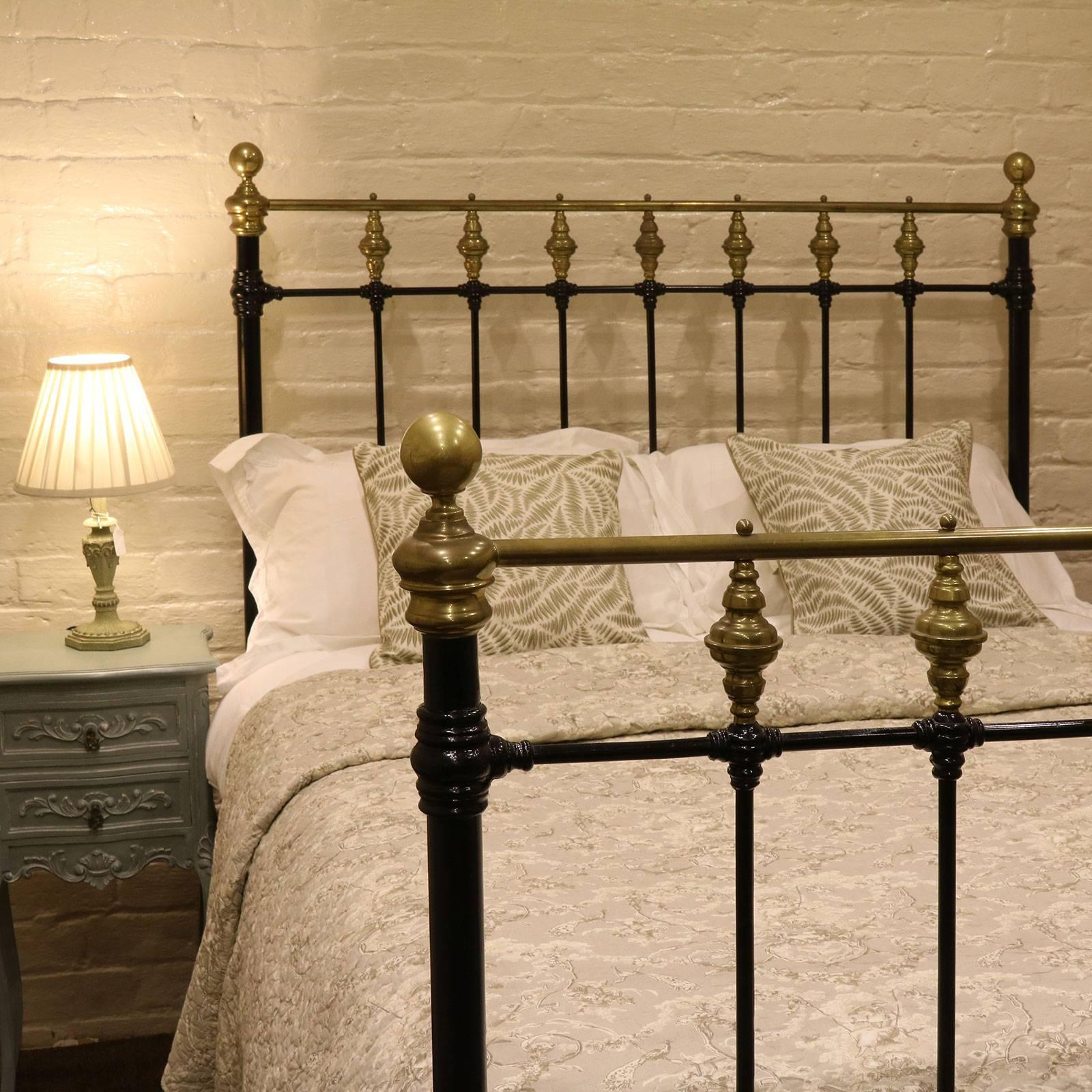 A Classic style Victorian brass and iron bed finished in black with a gallery of brass trumpets on head and foot panels.

This bed accepts a standard double (54 in wide) base and mattress set.

The price is for the bed alone. The base, mattress,