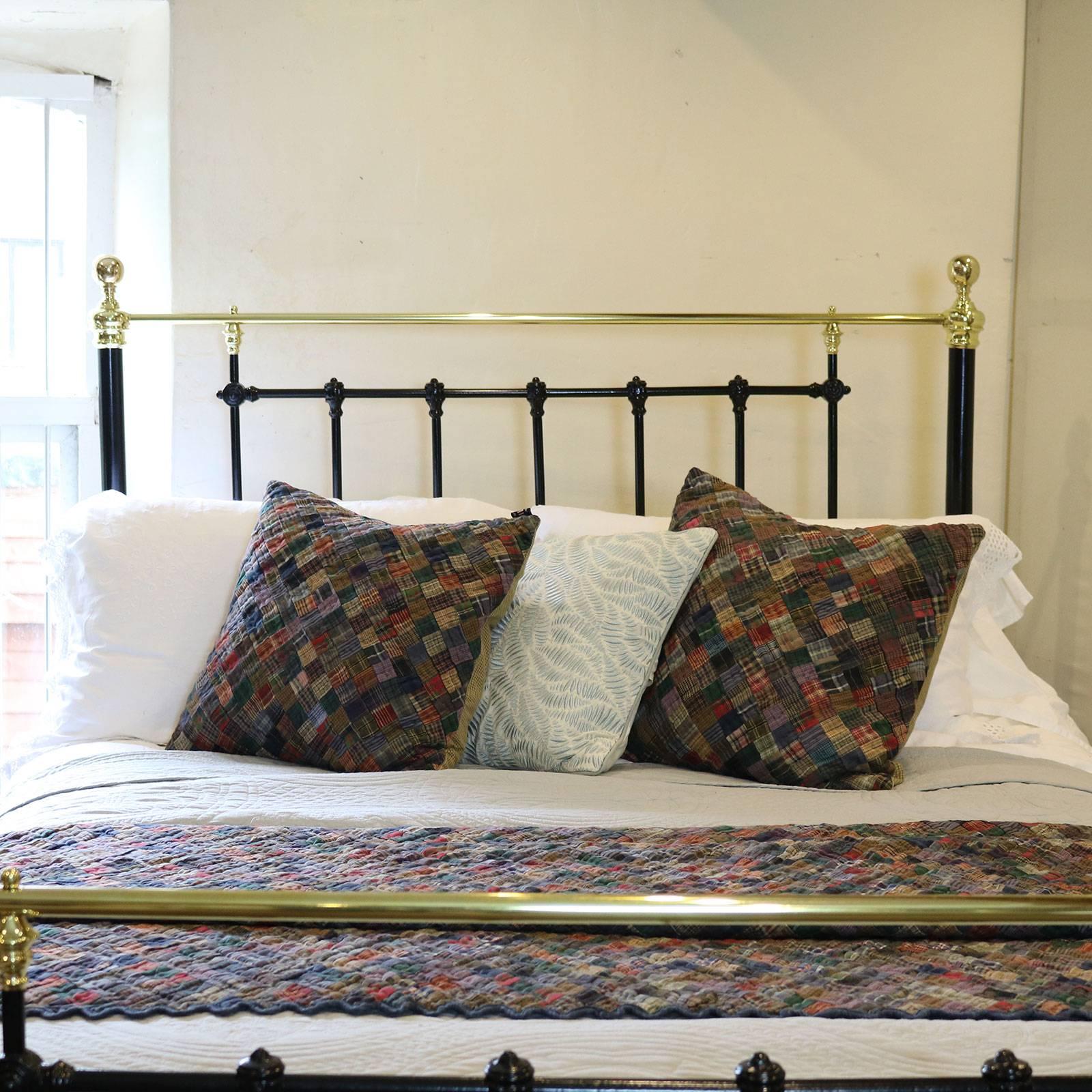 Classical Victorian cast iron and brass bedstead, finished in black with decorative cast iron mouldings, circa 1890. This frame has the added advantage of each bed end completely dismantling so it can go up any narrow or winding staircase.

This