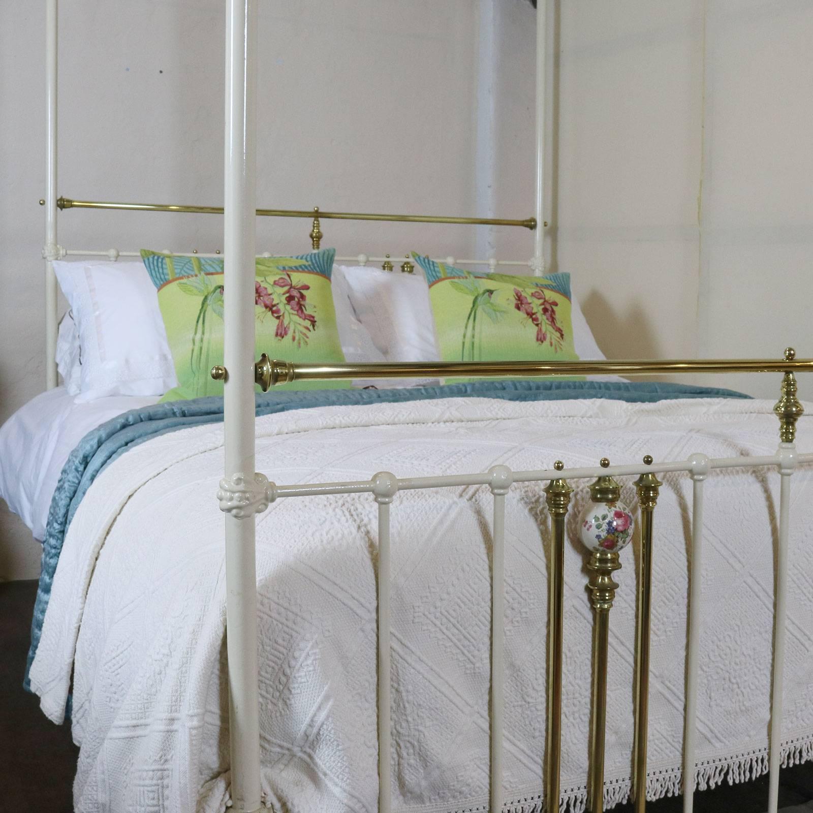 A brass and iron four poster bed adapted from an original Victorian frame, finished in cream, with china porcelain decoration.

This bed accepts a British king-size or American queen-size (60 inches wide) base and mattress set.

The price is for the