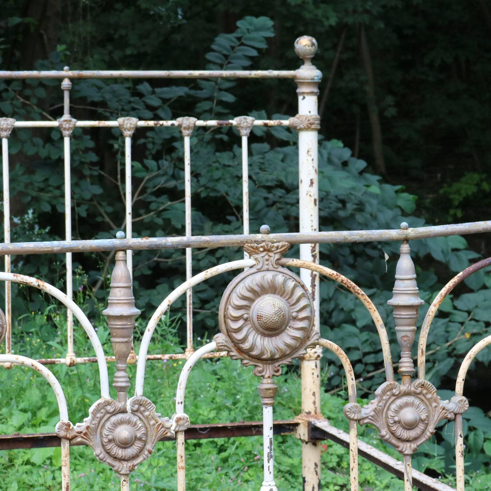 A brass and iron bed iron bed from the late Victorian era with superb castings and sunflower brass rosettes.

The bed will be fully restored in a color of your choice and extended to 60 inches wide, to accept a British king-size or American