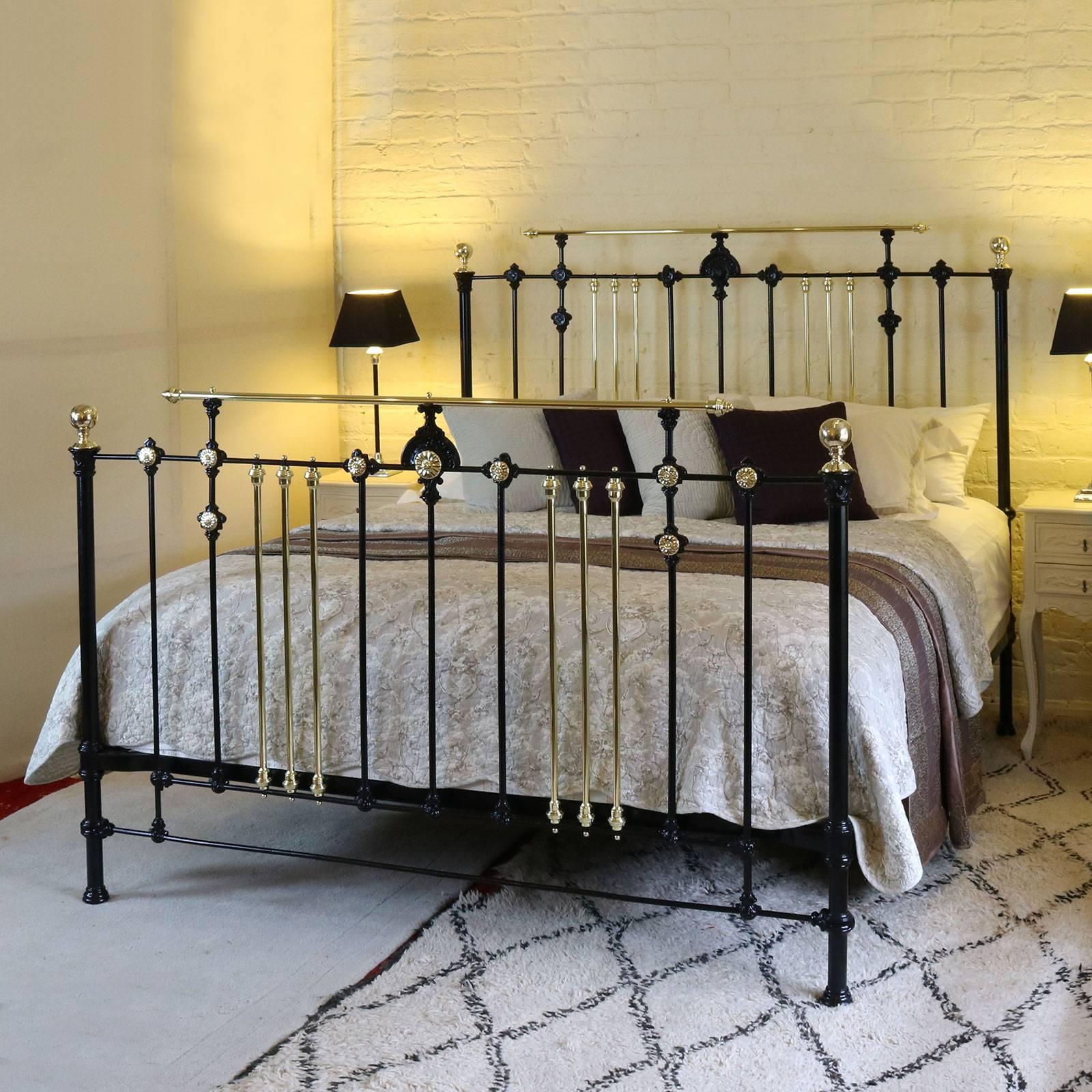 This unusual Gothic style bed has a attractive castings, decorative brass rosettes and raised gallery rail on head and foot.

This bed accepts a British super king-size or California king-size base and mattress set (72 inches wide). If necessary it