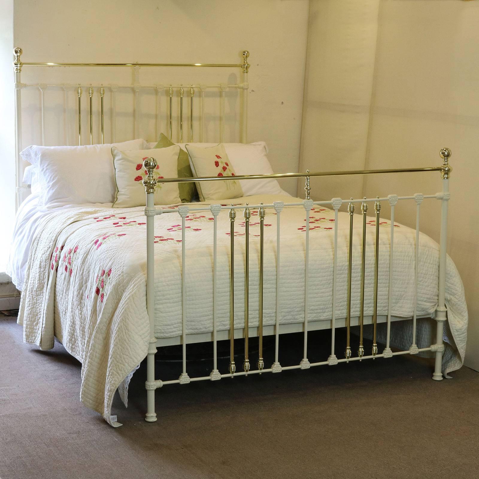This brass and iron bed is finished in soft cream and has attractive castings and straight brass top rail.

This bed accepts a British king-size or American queen-size base and mattress set (60 inches wide).

The price is for the bed alone. The