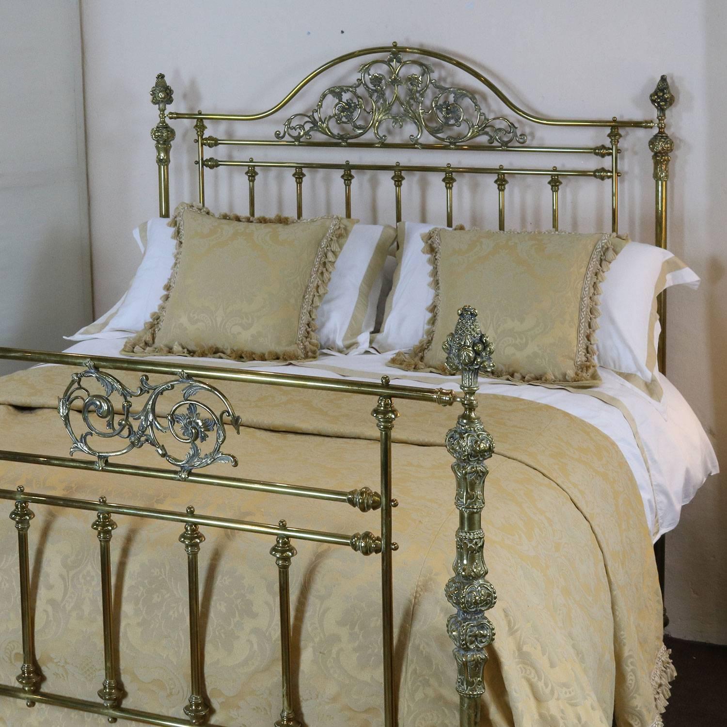 A superb all brass bedstead with decorative fittings and serpentine top rail on the head panel. A fine and rare example. MK91.

The brass is unpolished, with a faded patina. We can polish the bed if you wish, please inquire.

This bed accepts a