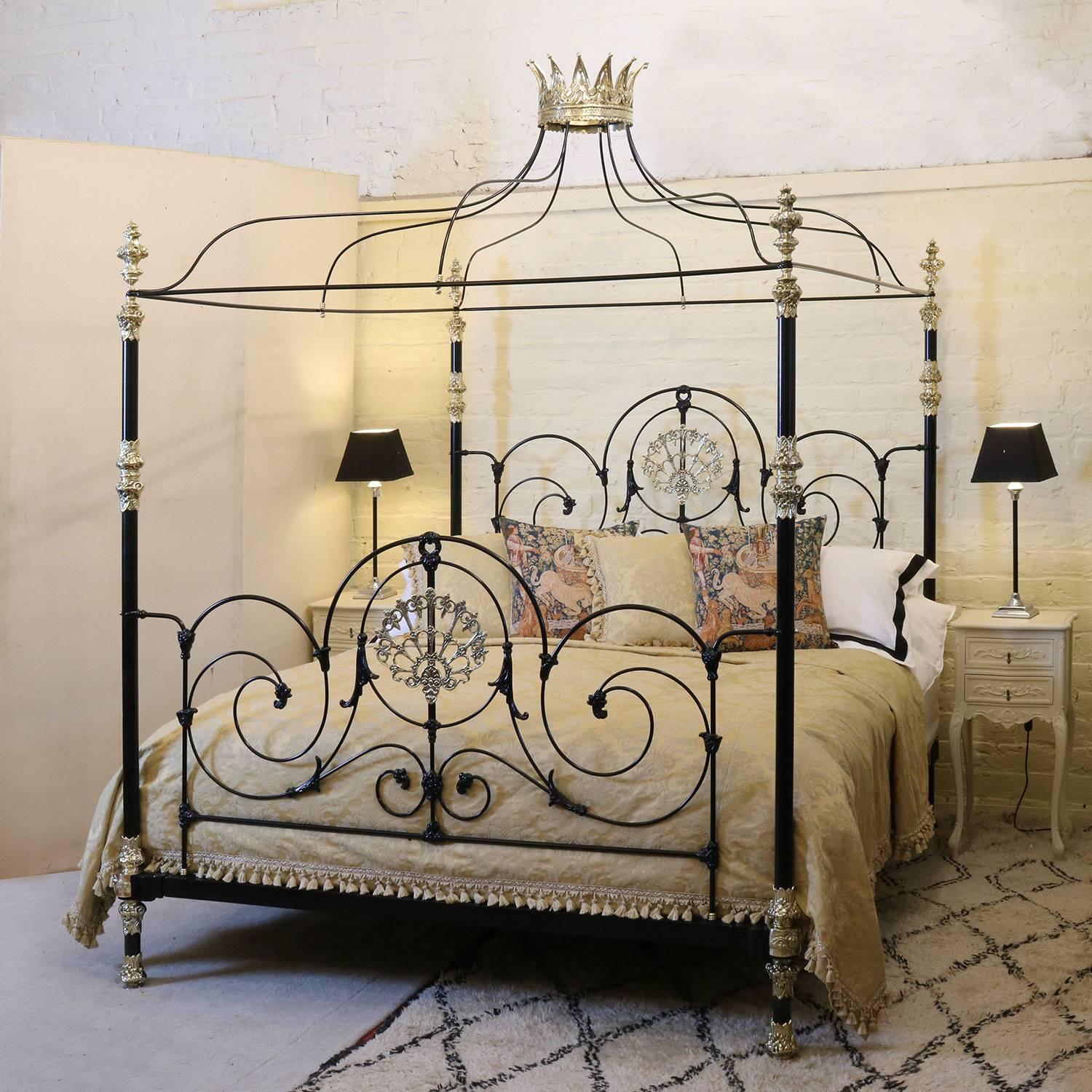 A made-to-order bespoke four poster bed with ornate brass castings, tentacle canopy and brass crown. This hand crafted bed is a bespoke piece designed with specific dimensions. The bed is currently black but other colours are optional, including