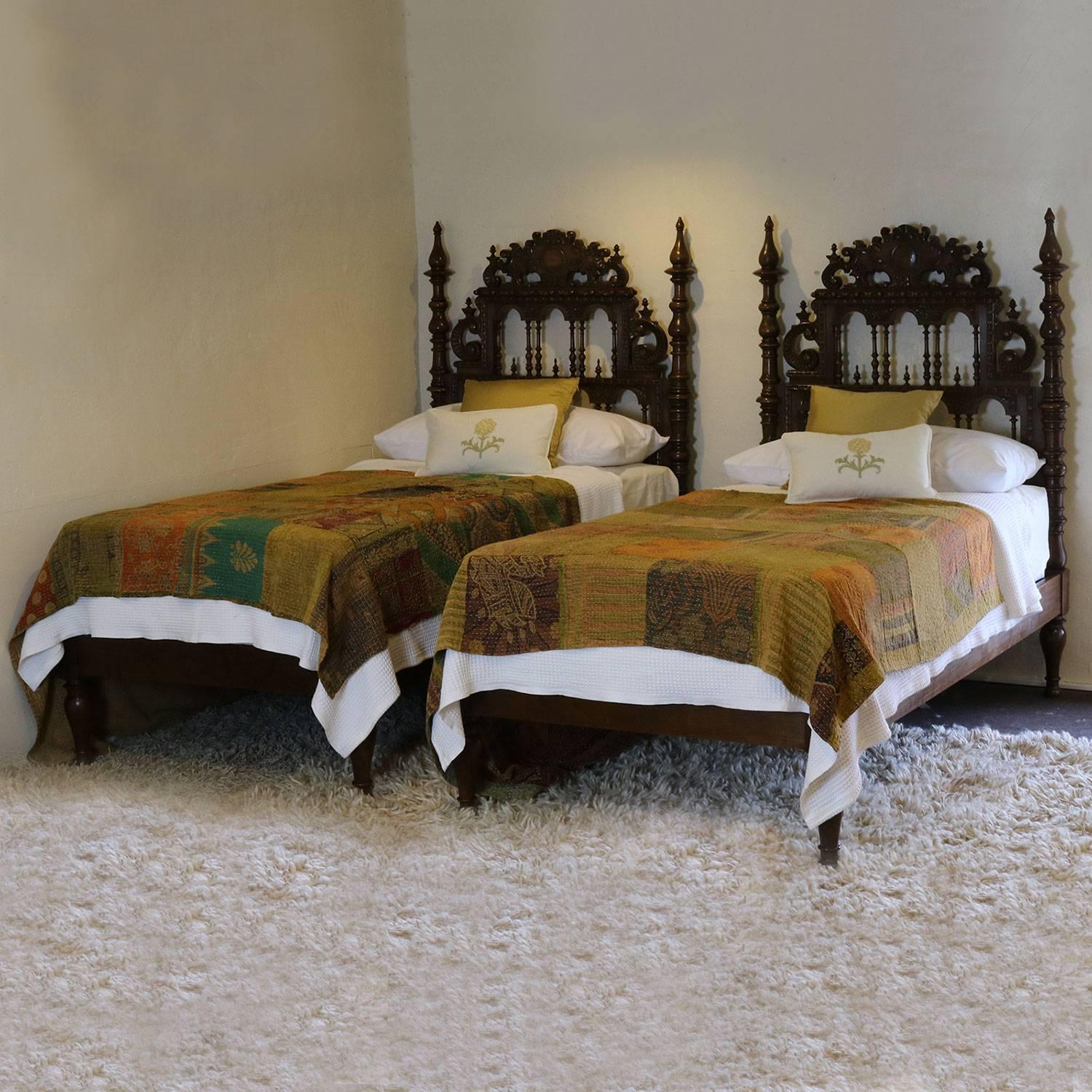 A stunning matching pair of twin Portuguese beds with ornate head panels.

These beds accept 39 inch wide (3ft 3in) bases and mattresses.

The price is for the bed frames alone. The bases, mattresses, bedding and linen are extra and supplied by