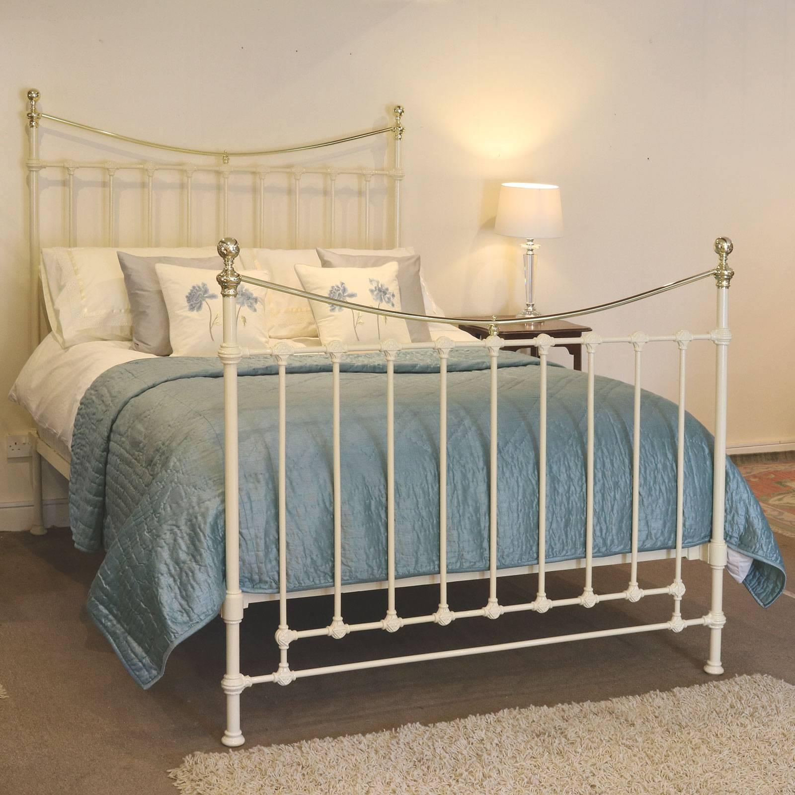 Brass and iron bed finished in cream with curved brass top rails and decorative castings. This bed is totally restored and adapted from an original antique frame.

This bed accepts a British king-size or American queen-size (60 inches, 5ft or