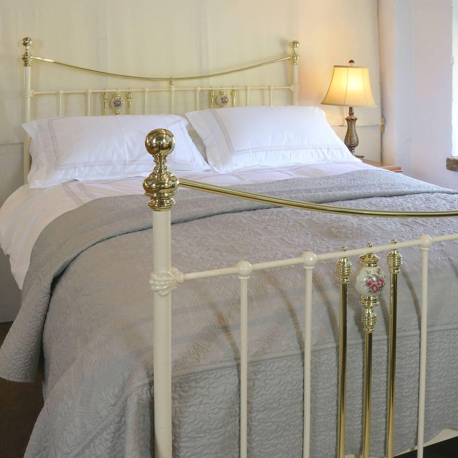 Victorian brass and cast iron bed with brass bar and floral china decoration.

This bed accepts a British king-size or American queen-size (60 inches, 5ft or 150cm wide) base and mattress set.

The price is for the bed frame alone. The base,