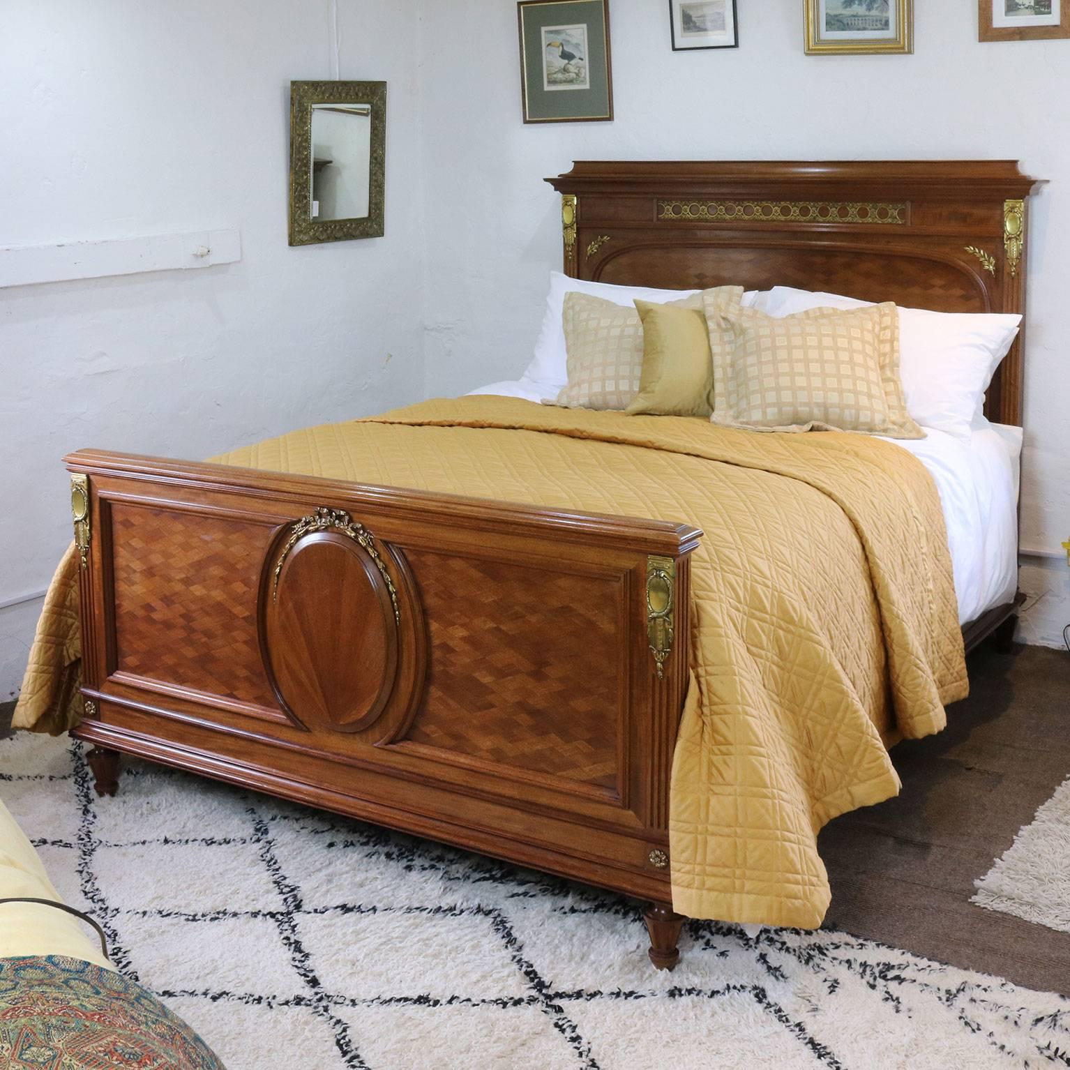 A fine inlaid bed with panels containing superb parquetry work, a central oval panel with sunburst veneer and fine ormolu.

This bed accepts a British king-size or American queen-size (60 inches wide, 5ft or 150 cm) base and mattress.

The price is