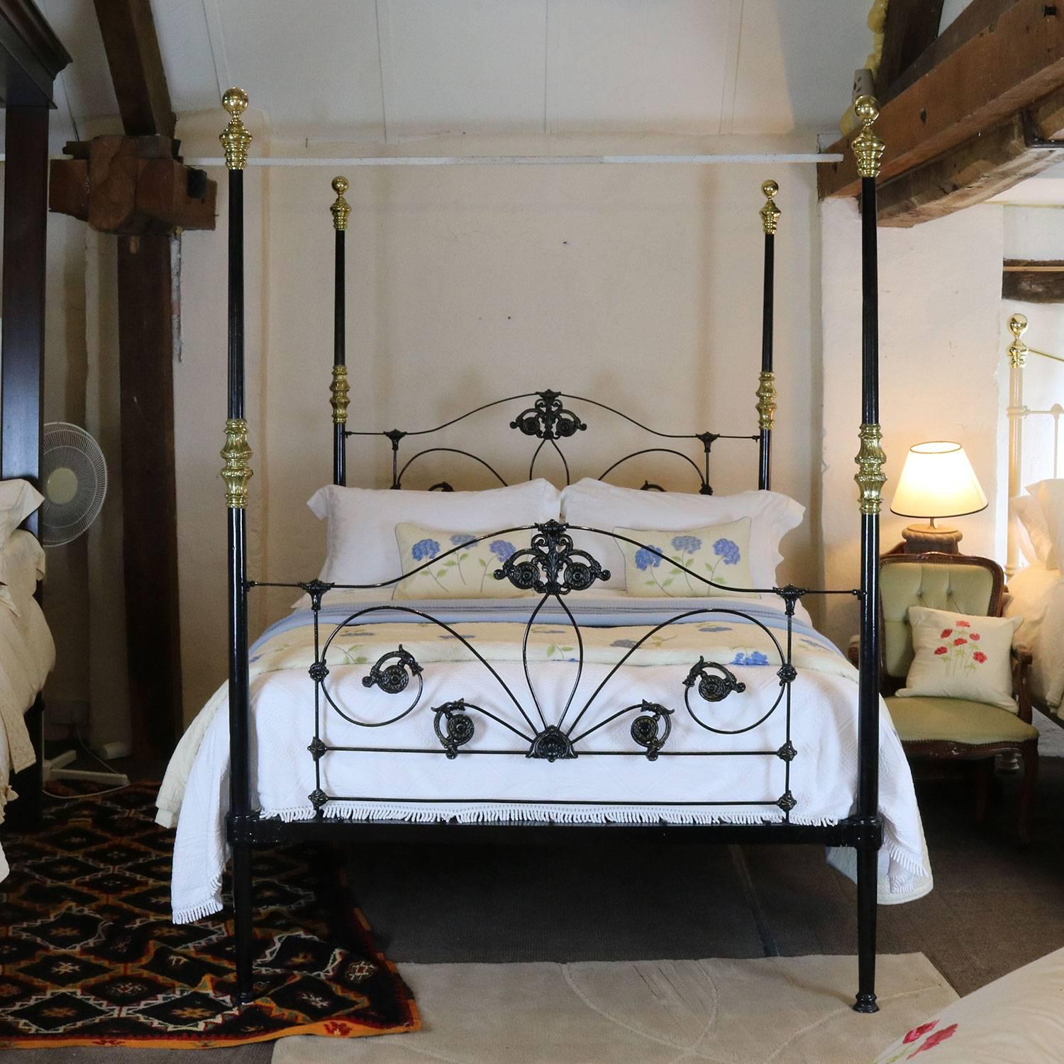 A late Victorian cast iron four poster bed finished in black with gold lined castings.

This bed can be refinished in another colour if you wish - please inquire.
Also, the height can be reduced if necessary.
There is an option of a canopy, either