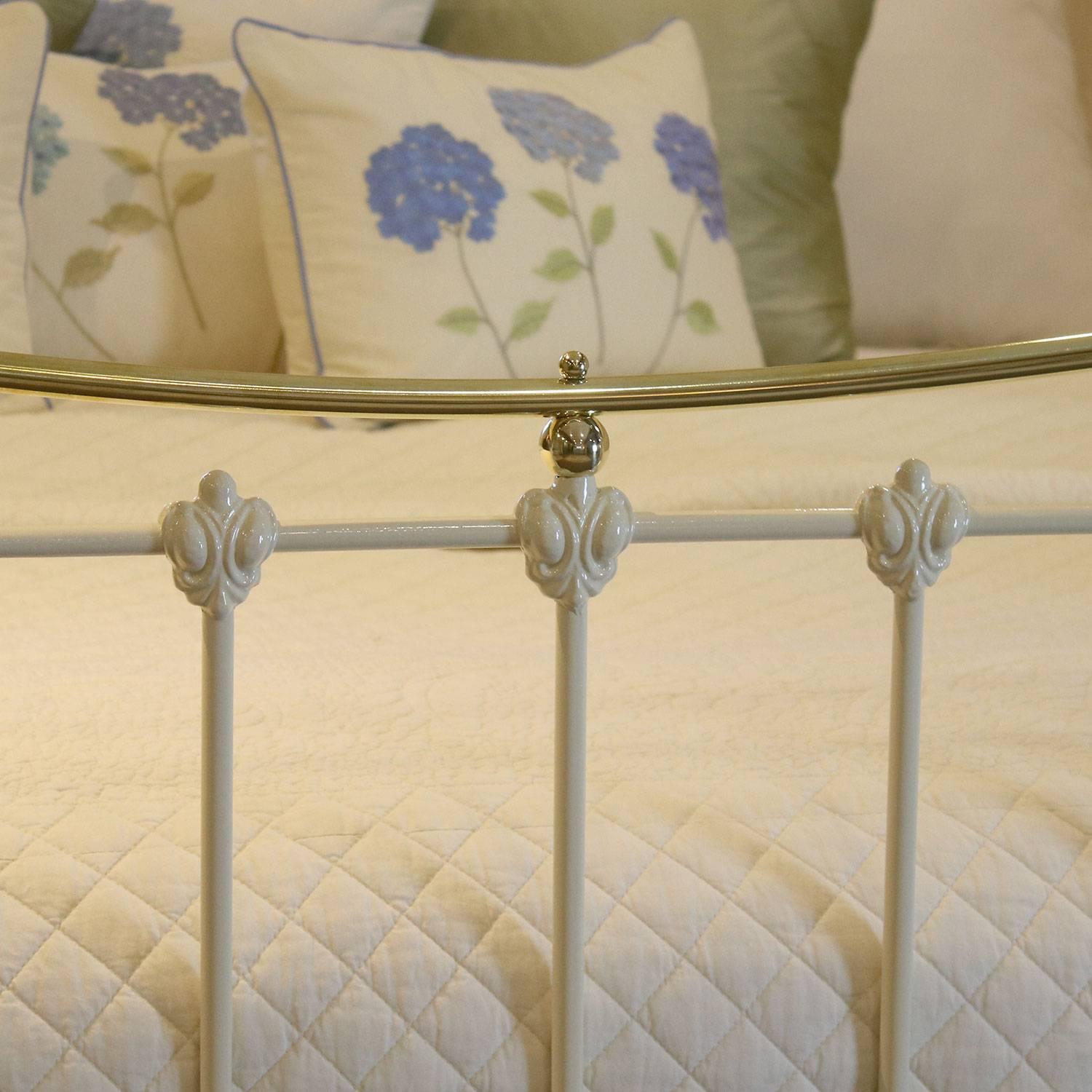 A brass and iron bed in cream with curved brass top rails, adapted from an original Victorian frame, circa 1895.

This bed accepts a British super king-size or Californian King (6ft, 72 inches or 180cm wide) base and mattress set.

The price is