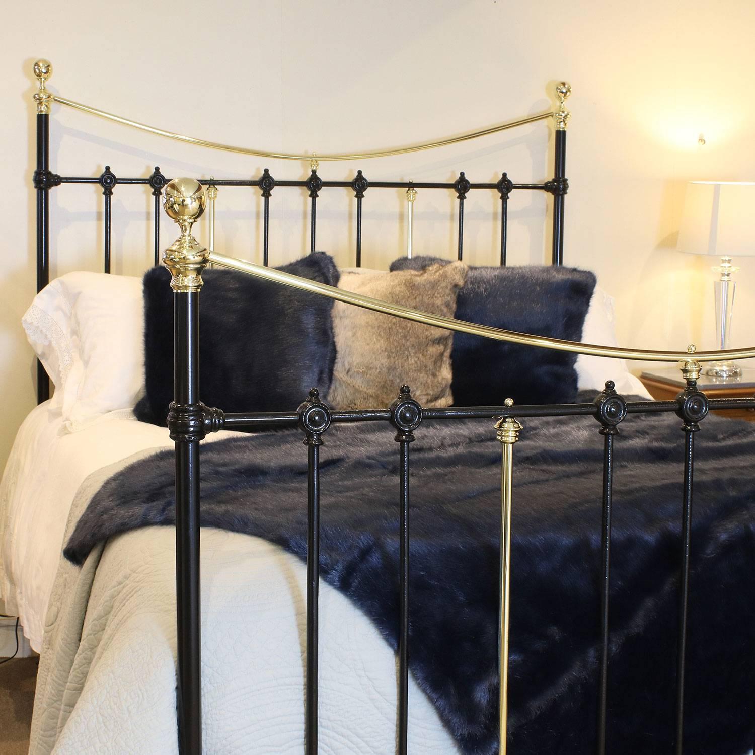 A brass and iron bed adapted from an original Victorian frame, circa 1895, with curved brass top rail.

This bed accepts a British king-size or American queen-size (60 inches, 5ft or 150cm) base and mattress set.

The price is for the bed frame