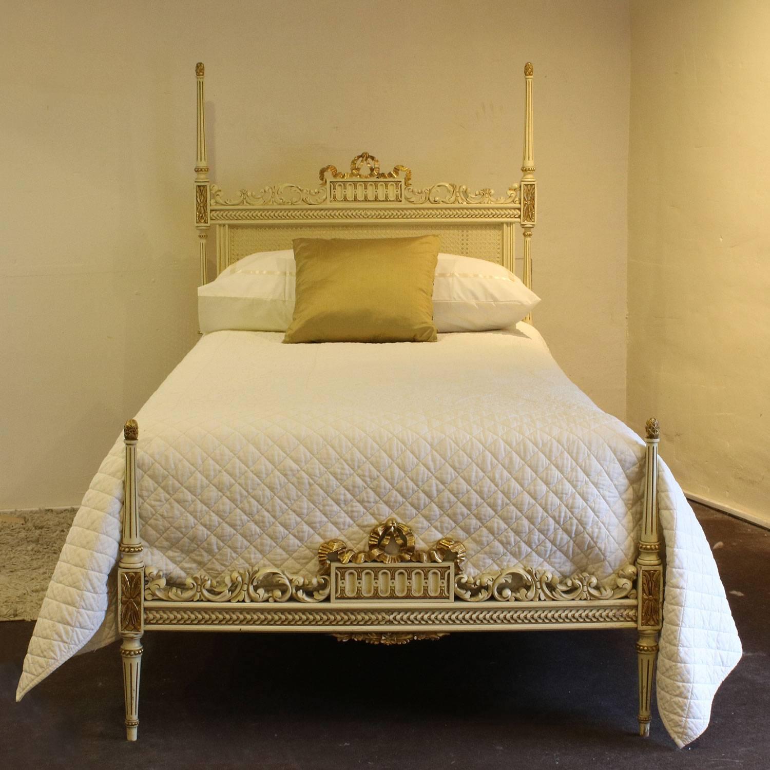 An attractive pair of twin beds with rattan cane panels, fine carving and torch on feet, painted in cream with gold.

These beds accept 3ft 3in wide bases and mattresses (39 in or 100cm) and the beds can Stand together to make a 6ft 6in wide bed