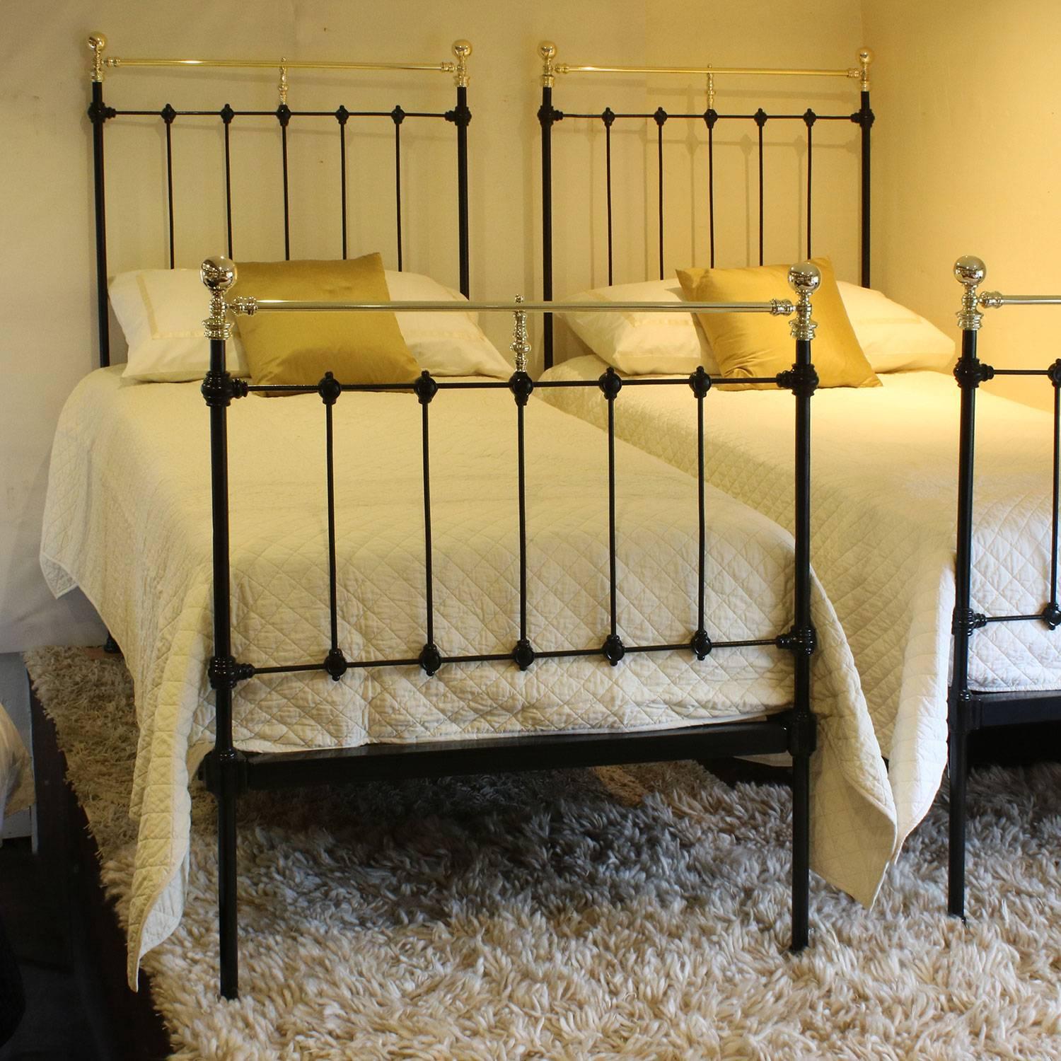 A matching pair of twin brass and iron beds finished in black with straight brass top rails.

These beds accept 3 ft wide (36 inch or 90 cm) bases and mattresses.

The price is for the beds alone, the bases, mattresses, bedding and linen are