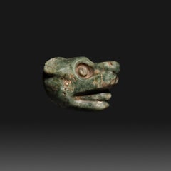 Hanging Jaguar Head. Mixteca, México. c. 1200 - 1551 AD. 5.5 cm length. Jade.