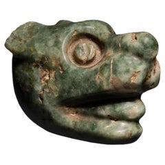 Hanging Jaguar Head. Mixteca, México. c. 1200 - 1551 AD. 5.5 cm length. Jade.