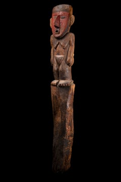 Funerary Post with female figure. Chimu, Peru, 1st Millennium AD. Wood. 106 cm.