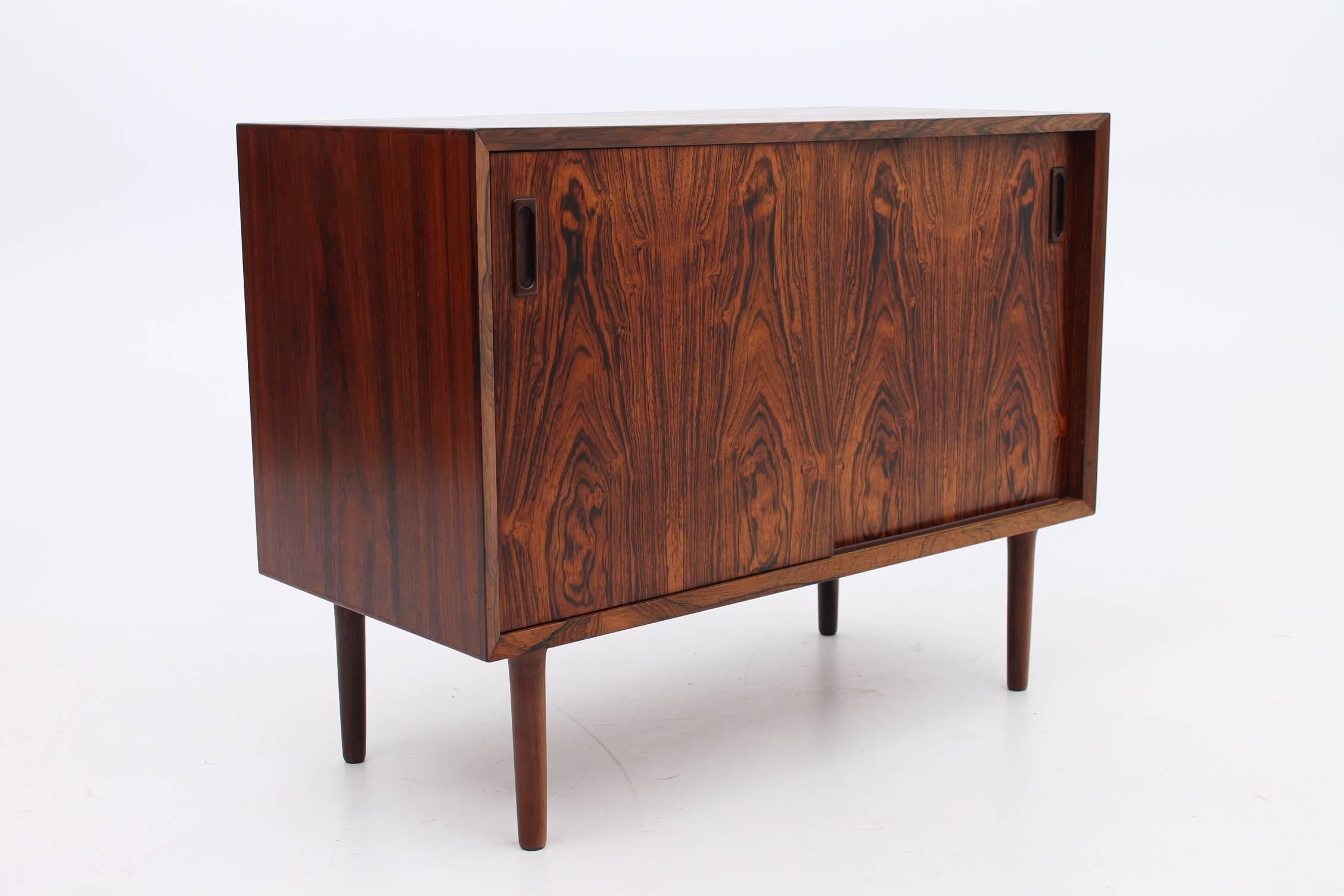 Rosewood cabinet and chest of drawers set designed by Lyby Møbler. This matching duo features a thick, vibrant rosewood grain that sets it apart from the rest. The set is incredibly versatile and can be pushed together to make one large, unique