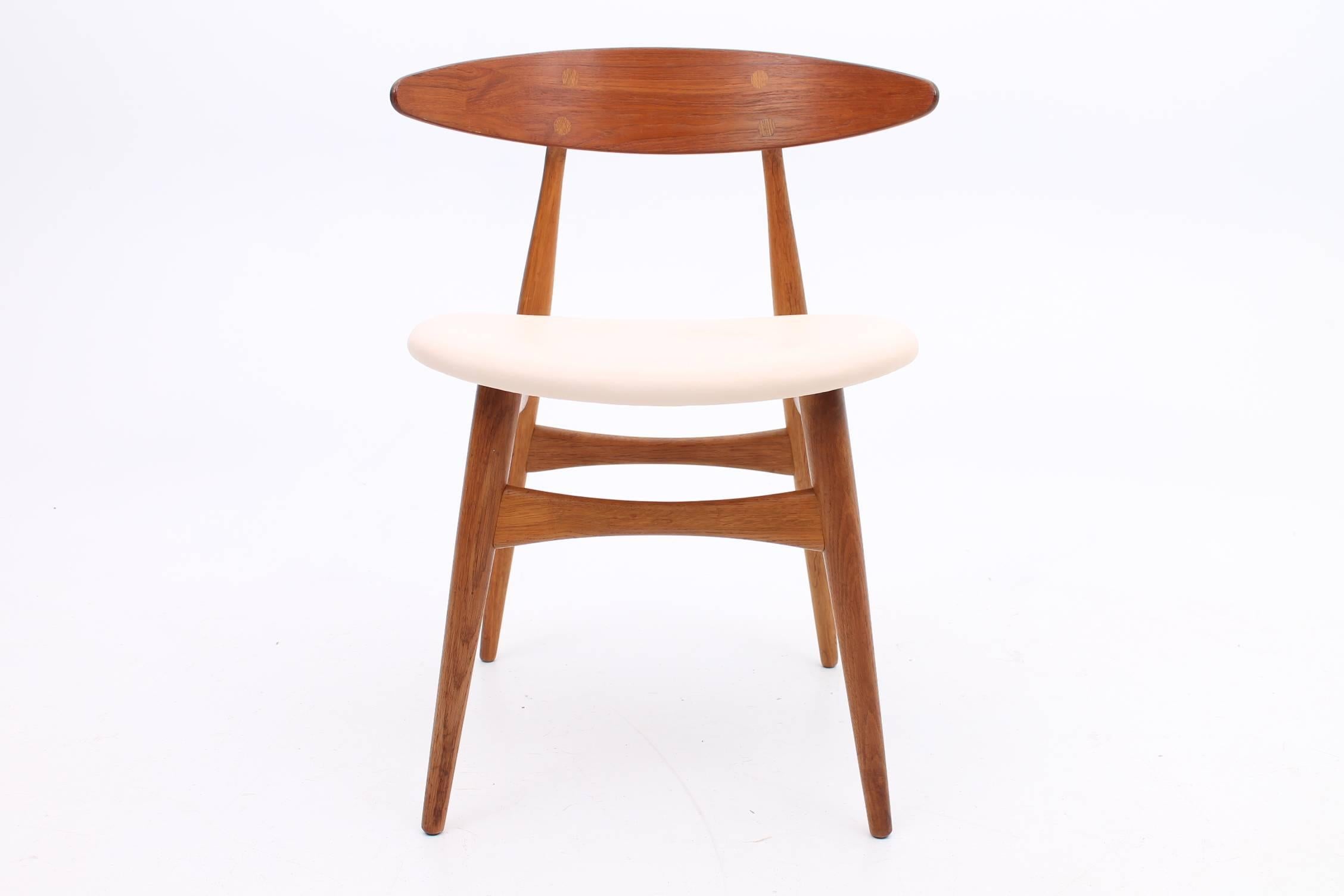 Danish Set of Two Teak and Oak  CH33 Chairs by Hans J Wegner with Cream Leather