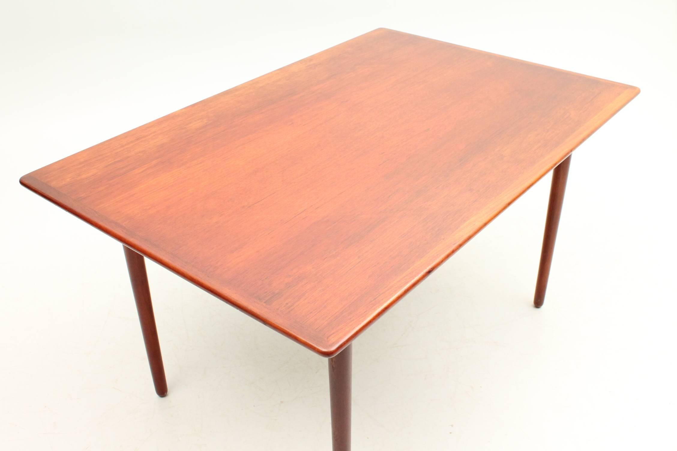 Beautiful table designed by Ib Kofod Larsen for Christiansen & Larsen. This table is constructed out of solid teak wood and is in excellent condition. This table is extremely versatile due to its size and would work well as a dining table, in a