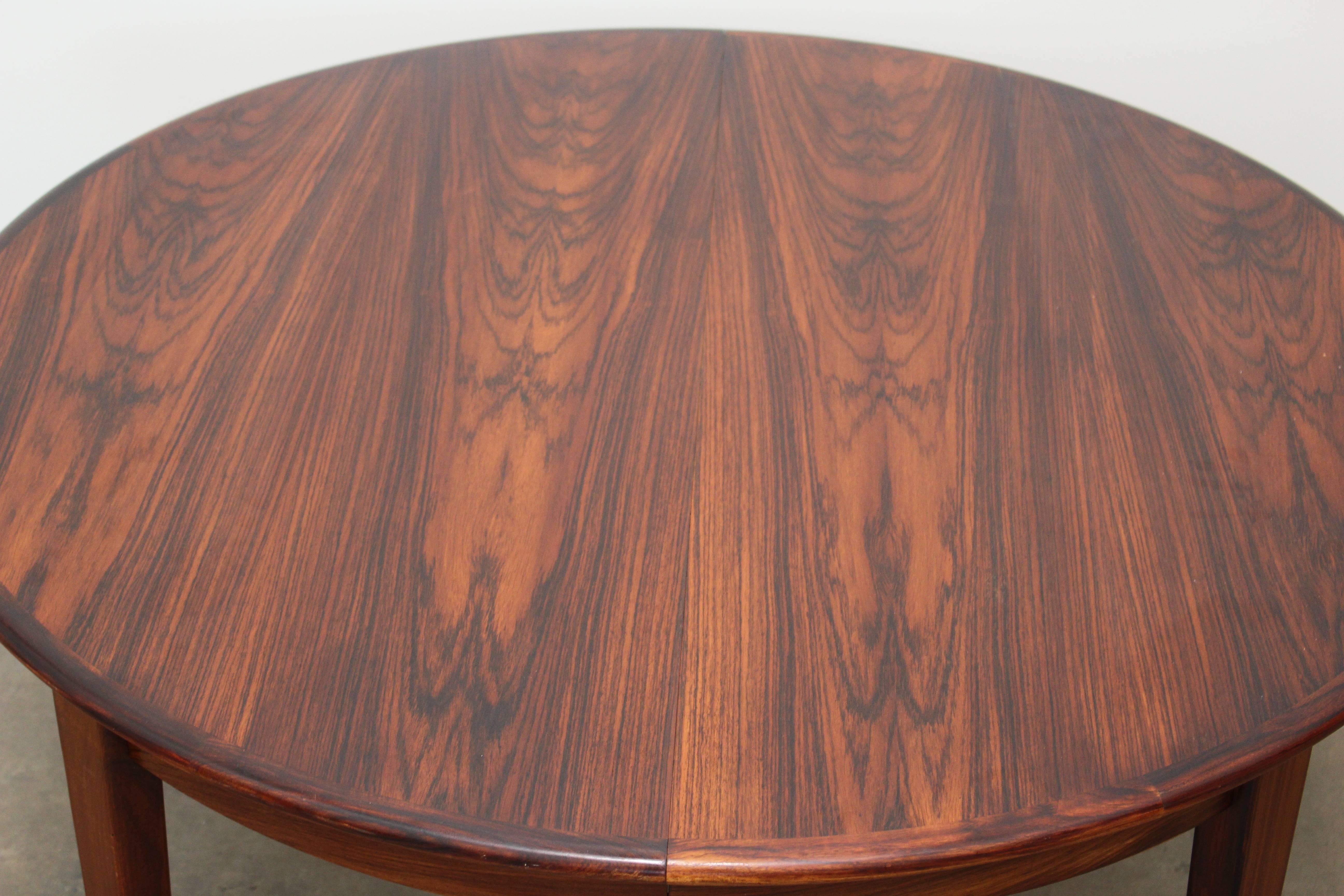 Mid-20th Century Rosewood Round Dining Table by H. Sign & Sons