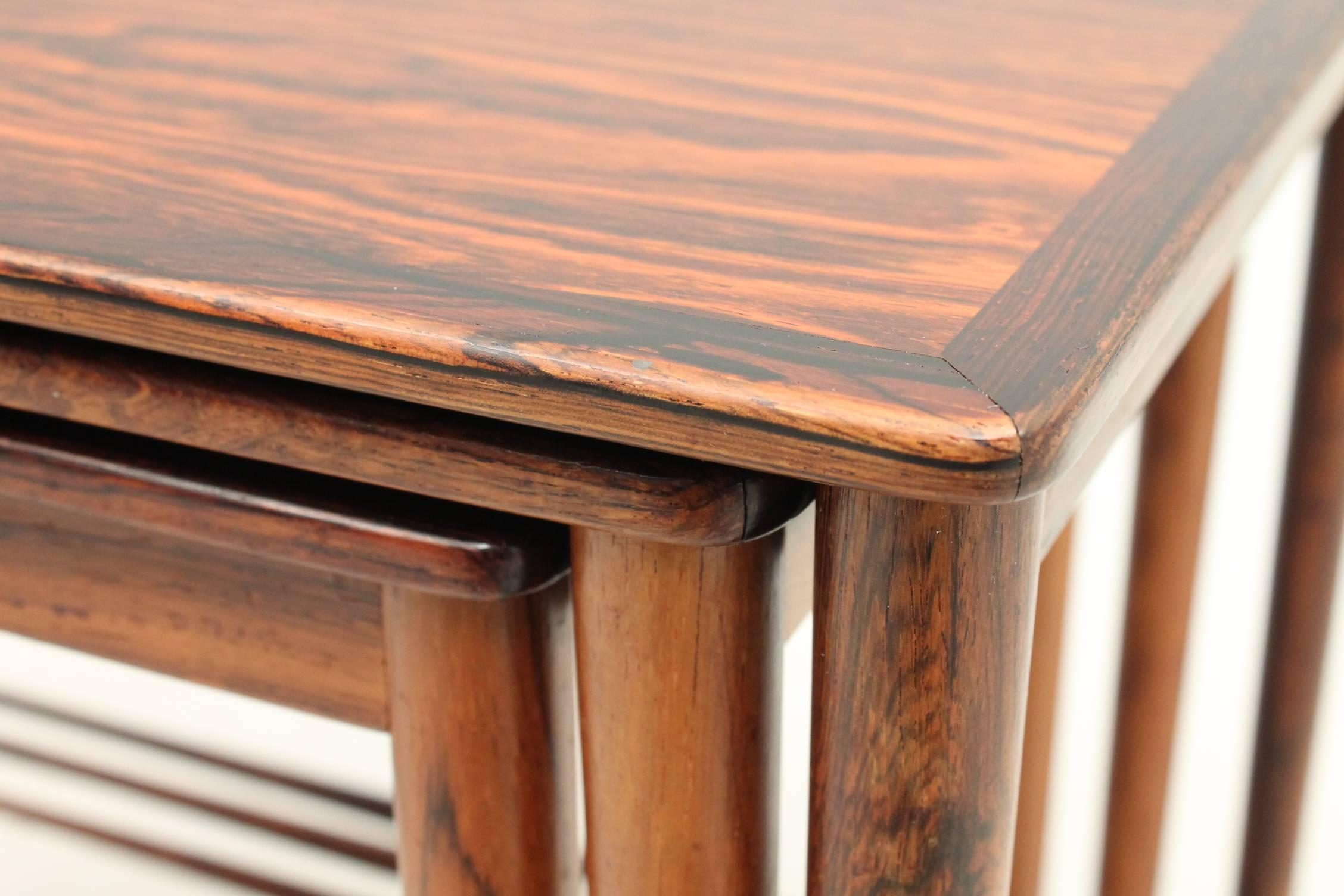 Beautiful set of nesting tables designed by Grete Jalk for P.Jeppesens Møbelsnedkeri. The set of tables are all three made of rosewood, have been professionally restored and have original stamps on the bottom. The dimensions are taken of the largest